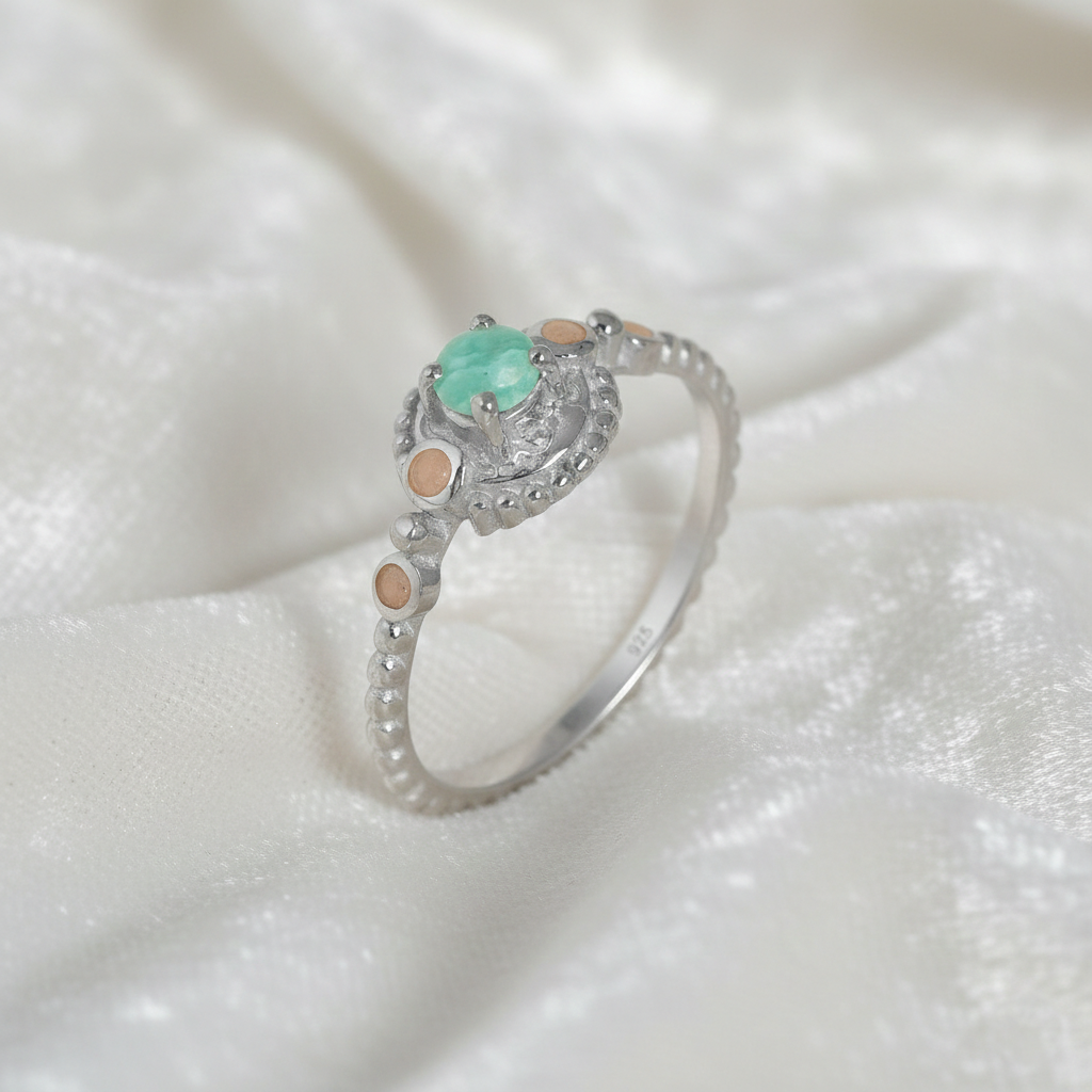 Amazonite-ring-with-round-amazonite-and-peach-moonstone-sterling-silver-angled-view-on-satin-background