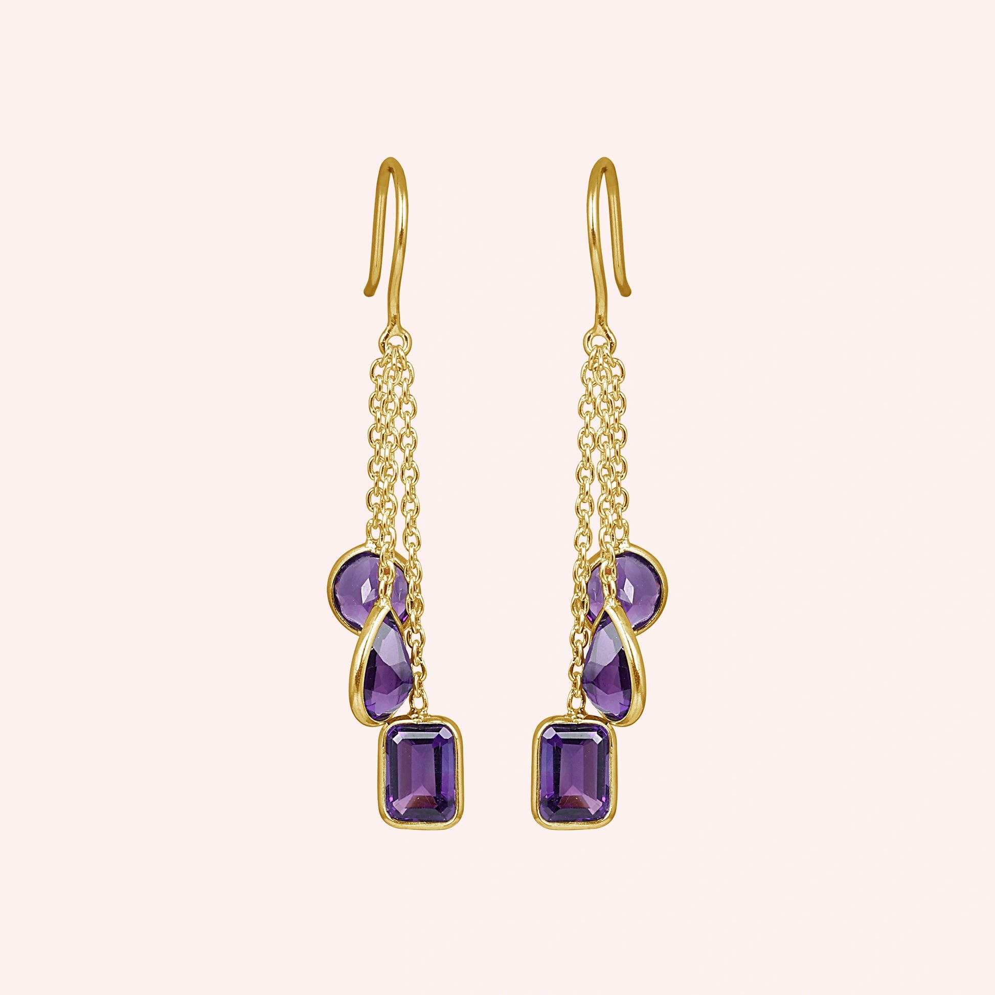 boho_earrings_front_view_gold_plated_chain_drop_amethyst_earrings_with_purple_gemstones_on_soft_pink_background