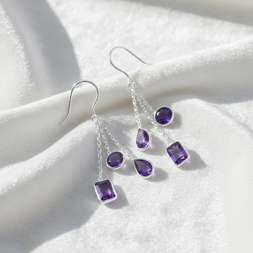 boho_earrings_top_angle_chain_drop_amethyst_earrings_in_sterling_silver_with_purple_gemstones_on_white_silk_background