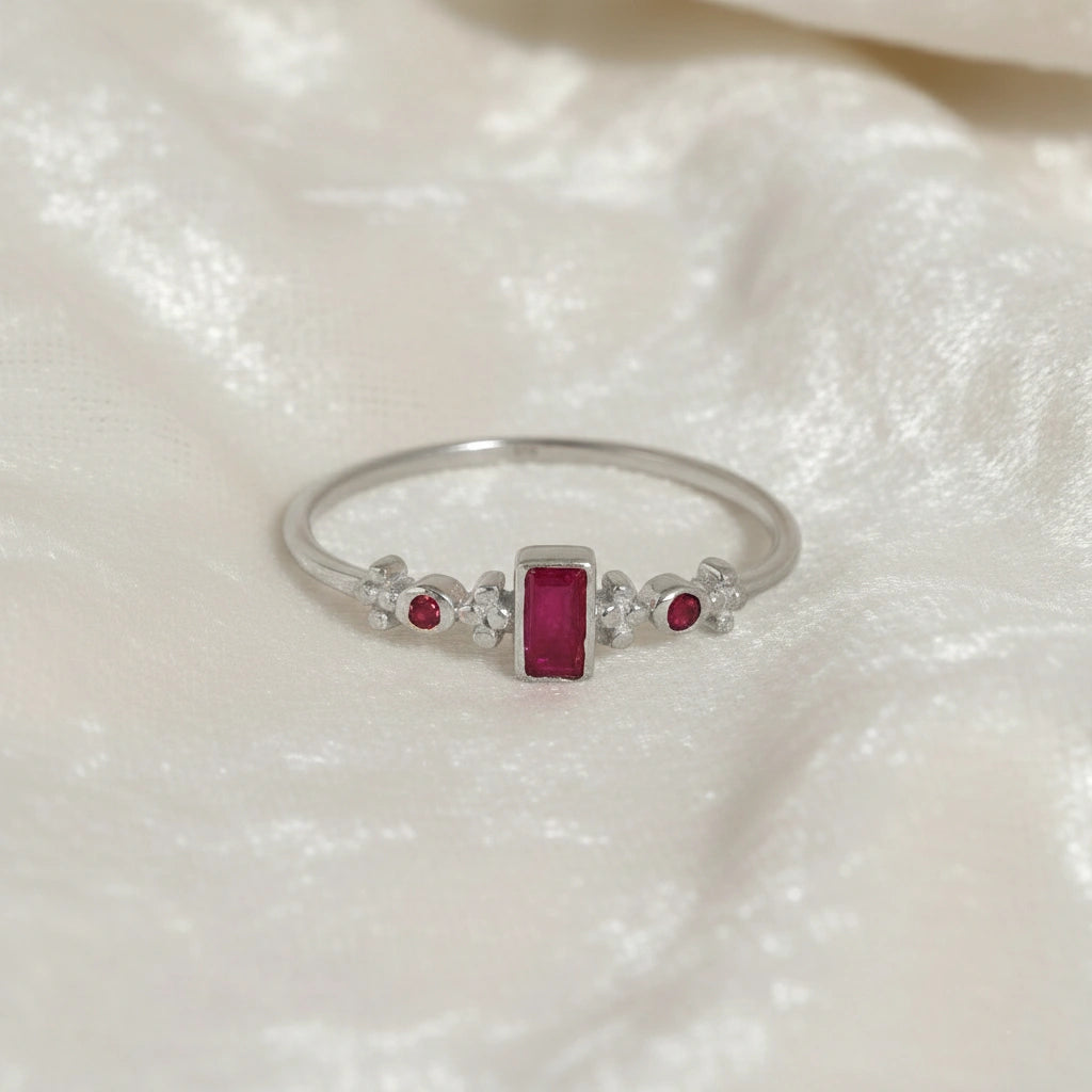 Baguette-ring-with-ruby-and-garnet-gemstones-sterling-silver-front-view-on-white-satin-background