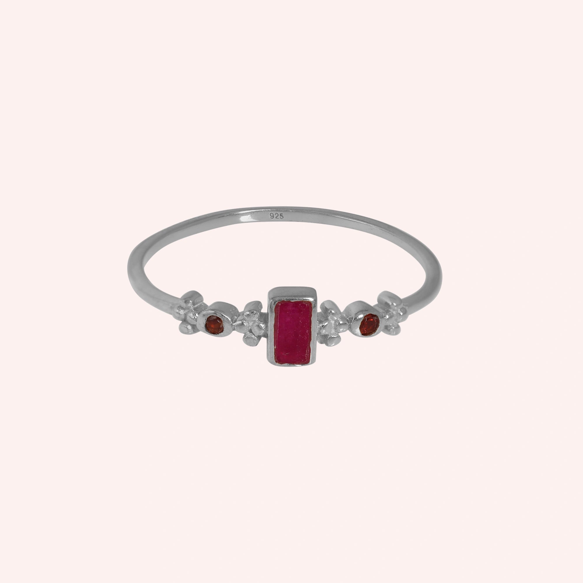 Baguette-ring-with-ruby-and-garnet-gemstones-sterling-silver-front-view-on-soft-pink-background