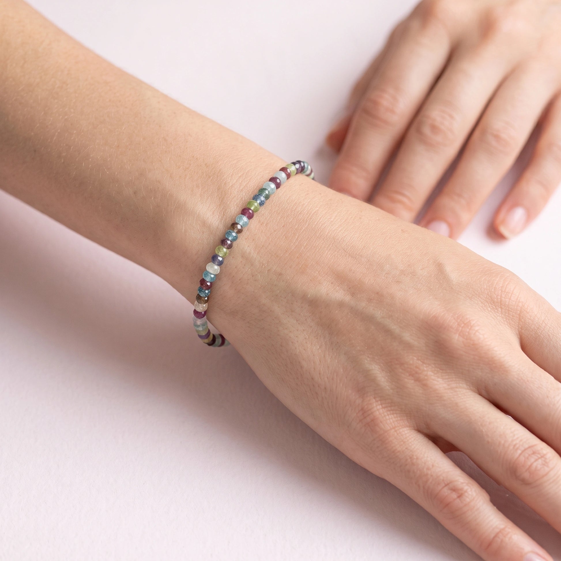 Beads_bracelet_with_multi_stones_in_sterling_silver_worn_by_a_model