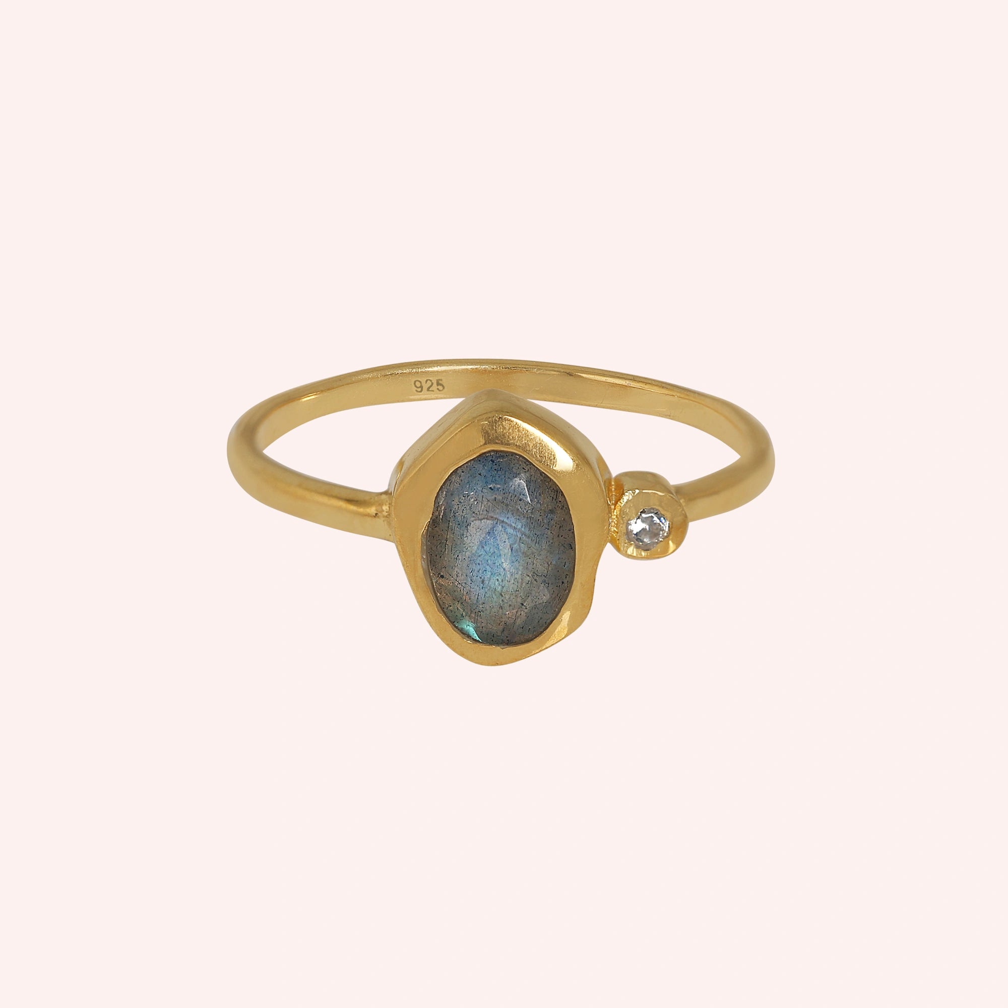 Bezel-set-ring-with-labradorite-and-white-topaz-stones-gold-plated-silver-front-view-on-soft-pink-background