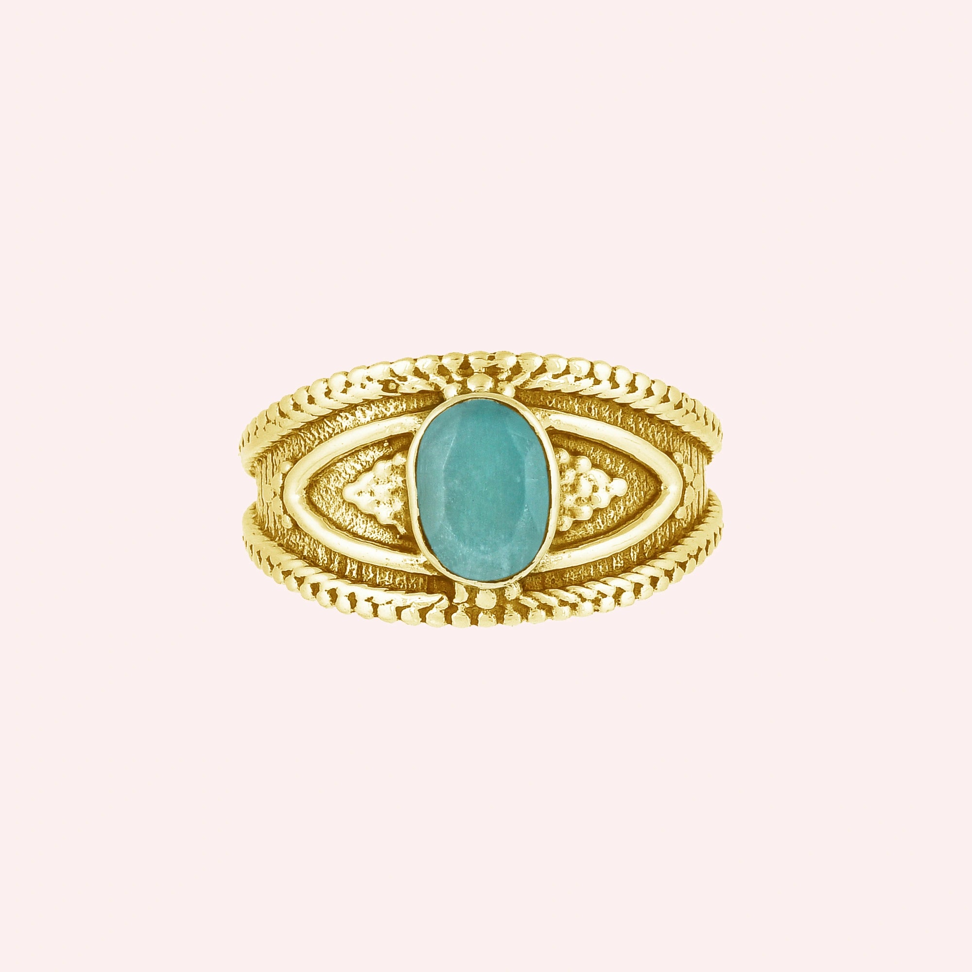 Boho_ring_with_amazonite_stone_gold_plated_silver_with_filigree_texture_in_front_angle_view_on_solid_pink_background