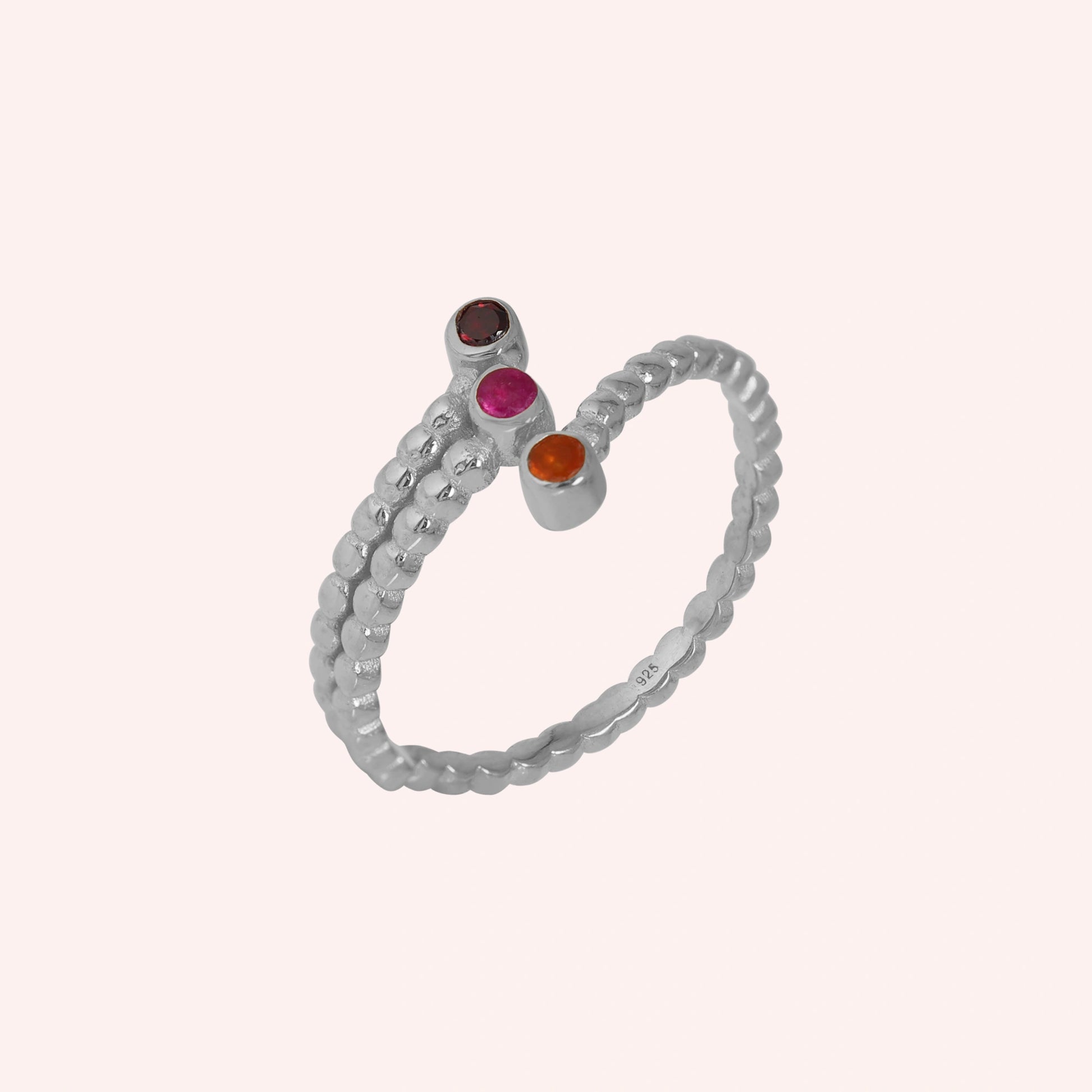 Bubble-ring-with-ruby-carnelian-garnet-gemstones-sterling-silver-front-view-on-soft-pink-background