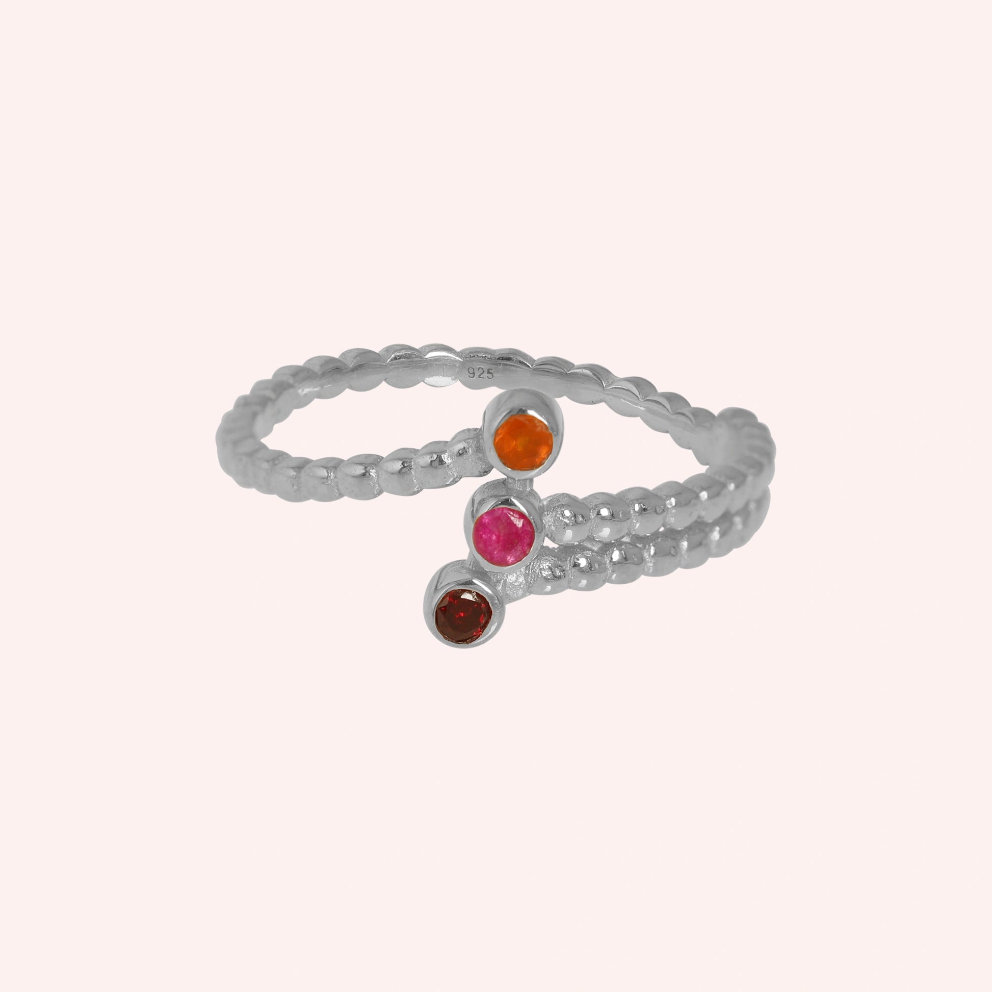 Bubble-ring-with-ruby-carnelian-garnet-gemstones-sterling-silver-front-view-on-soft-pink-background
