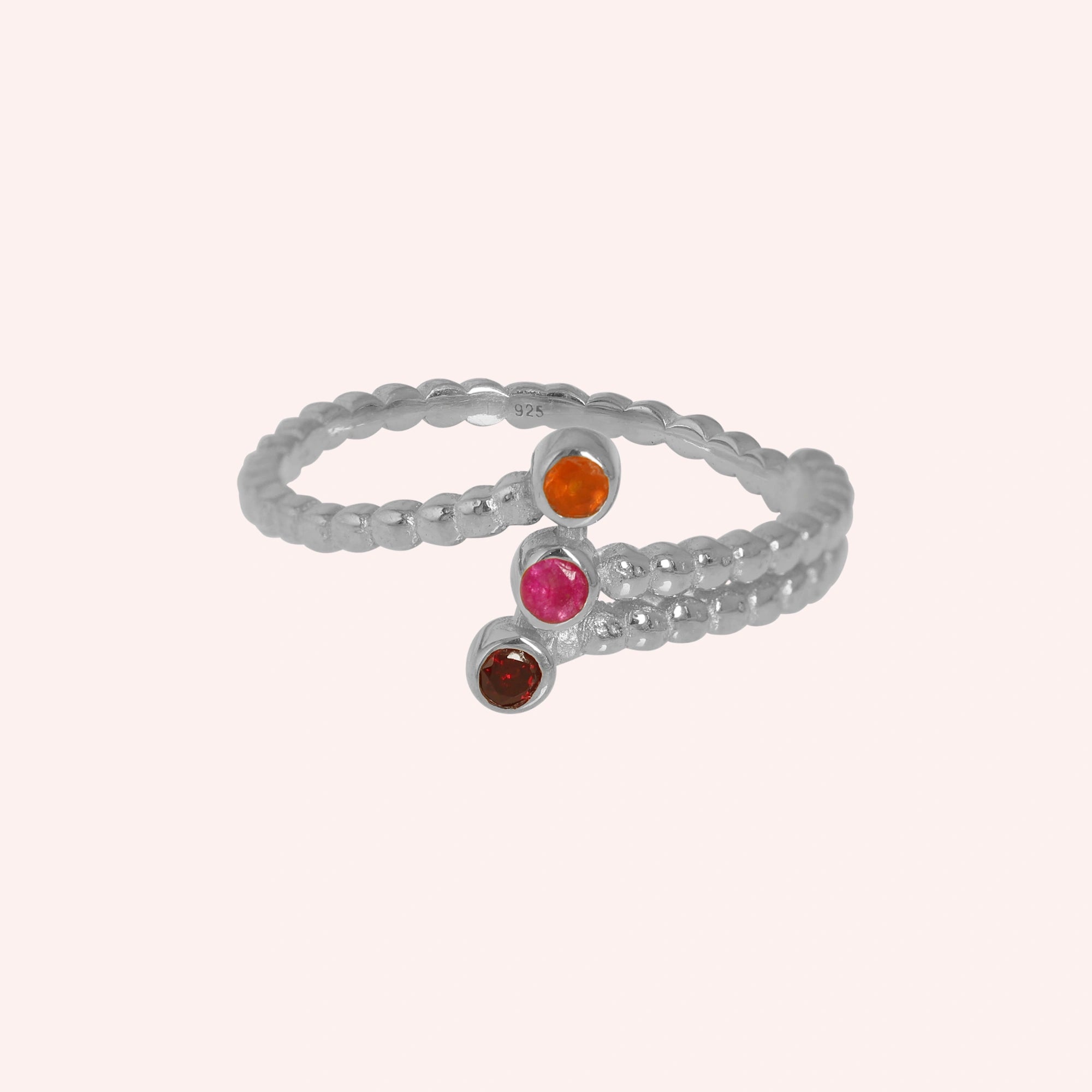 Bubble-ring-with-ruby-carnelian-garnet-gemstones-sterling-silver-front-view-on-soft-pink-background