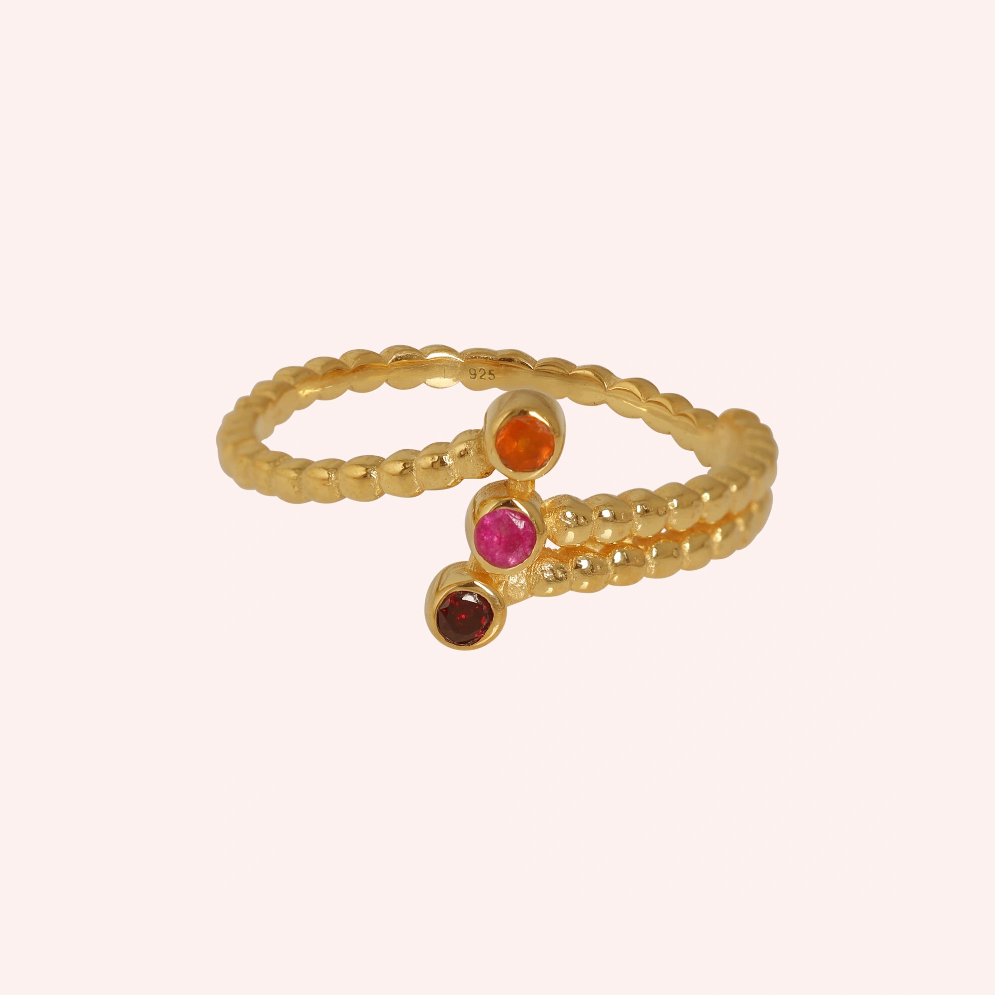 Bubble-ring-with-ruby-carnelian-garnet-gemstones-gold-plated-silver-front-view-on-soft-pink-background