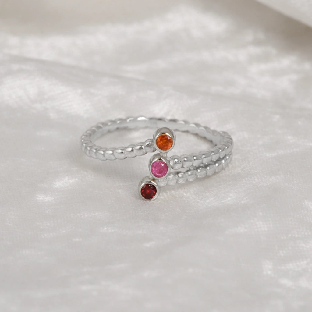Bubble-ring-with-ruby-carnelian-garnet-gemstones-sterling-silver-front-view-on-white-satin-background