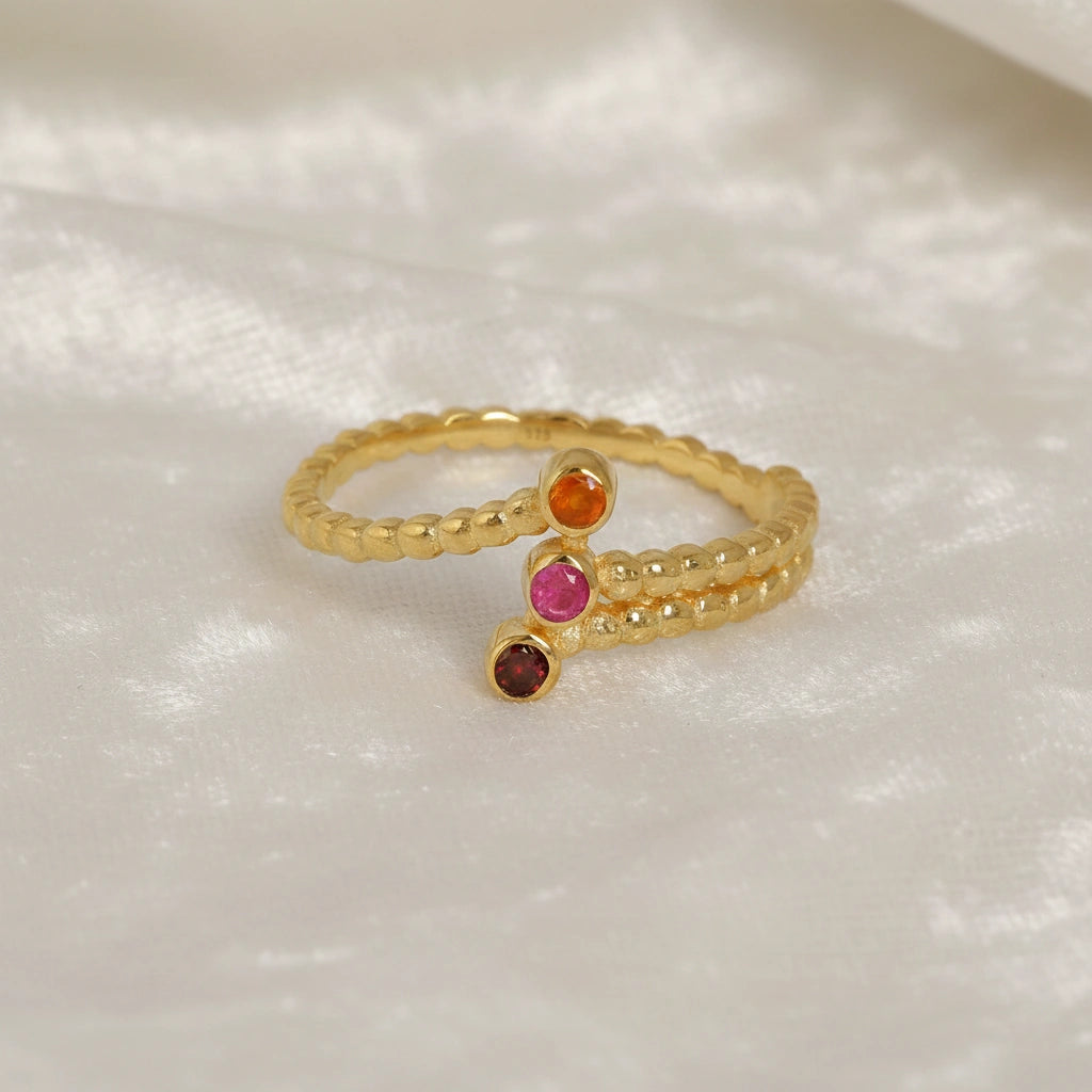 Bubble-ring-with-ruby-carnelian-garnet-gemstones-gold-plated-silver-front-view-on-white-satin-background