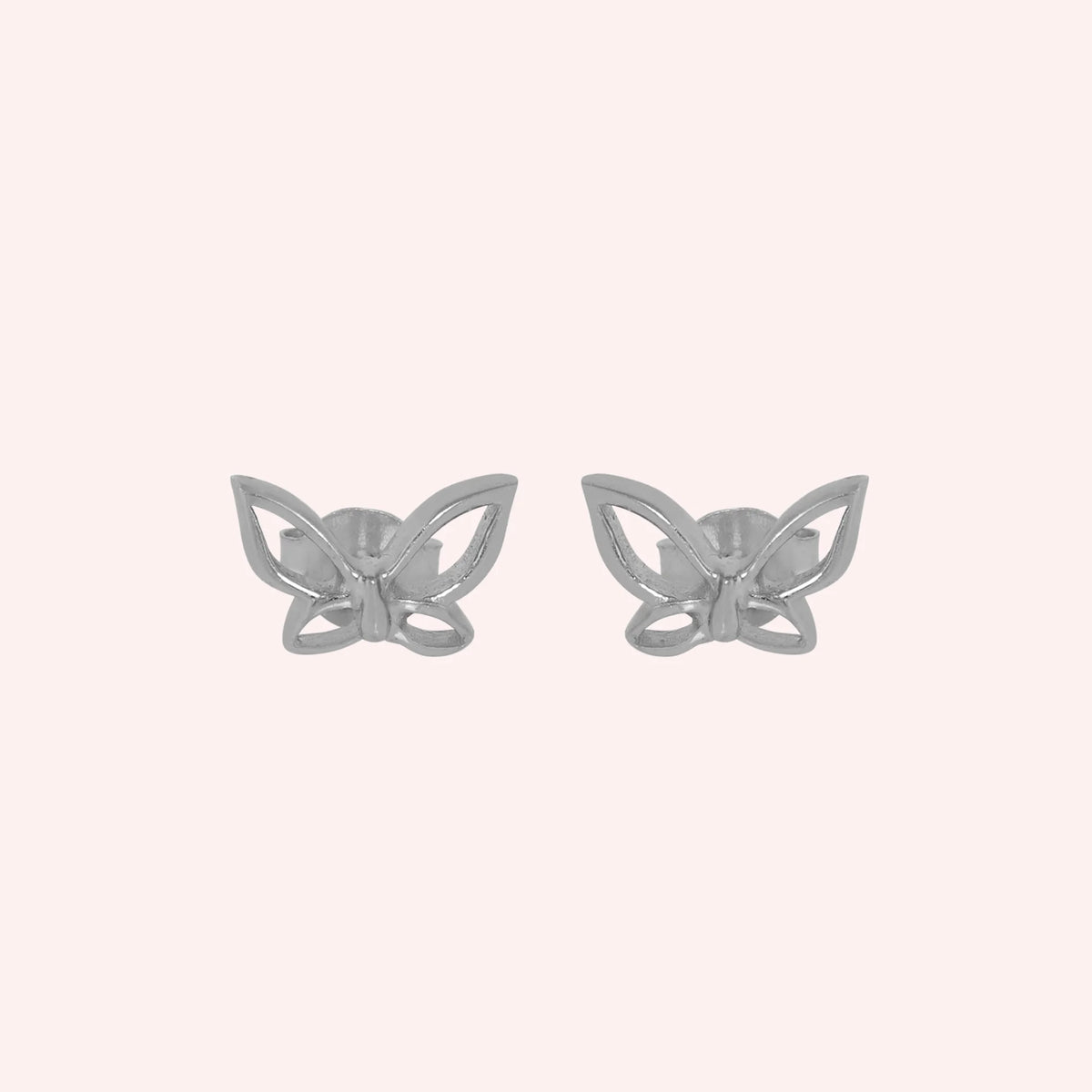 Butterfly_earrings_in_sterling_silver_in_a_stud_design_at_front_angle_view_on_solid_pink_background
