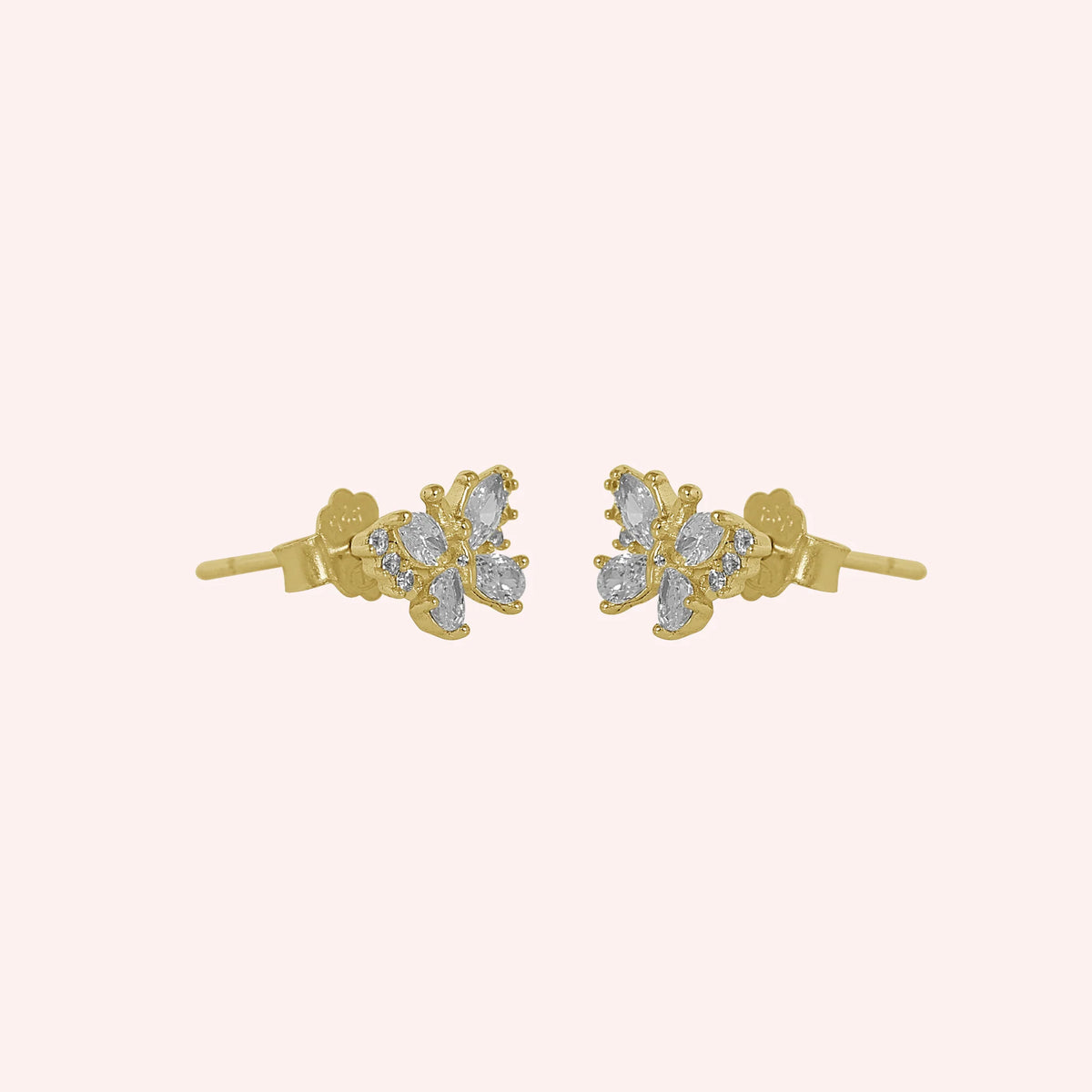 Diamond_butterfly_earrings_in_gold_plated_silver_with_lab_grown_diamonds_at_side_angle_view_on_solid_pink_background