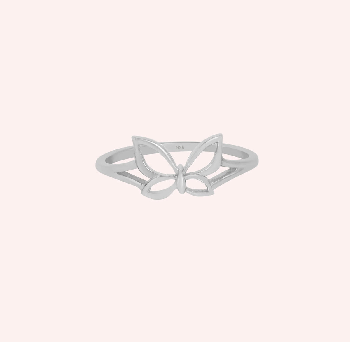 Butterfly_ring_in_sterling_silver_at_front_angle_view_on_solid_pink_background
