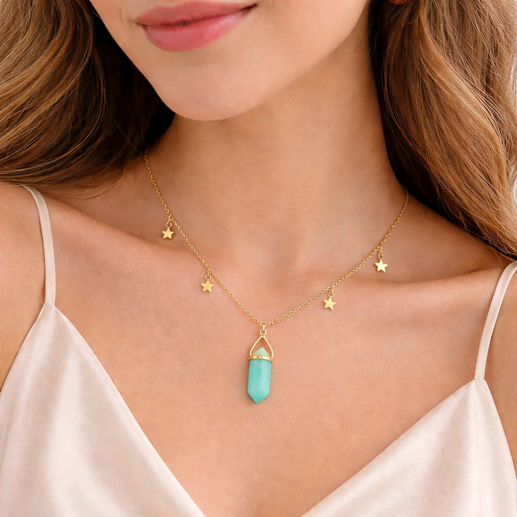 Charm_necklace_in_front_angled_view_with_gold_plated_silver_chain_star_charms_and_amazonite_stone_on_soft_fabric_background