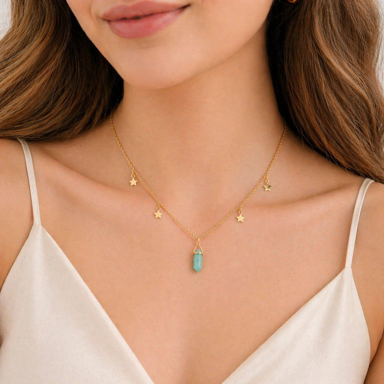 Charm_necklace_with_gold_plated_silver_chain_star_charms_and_amazonite_stone_worn_by_a_model