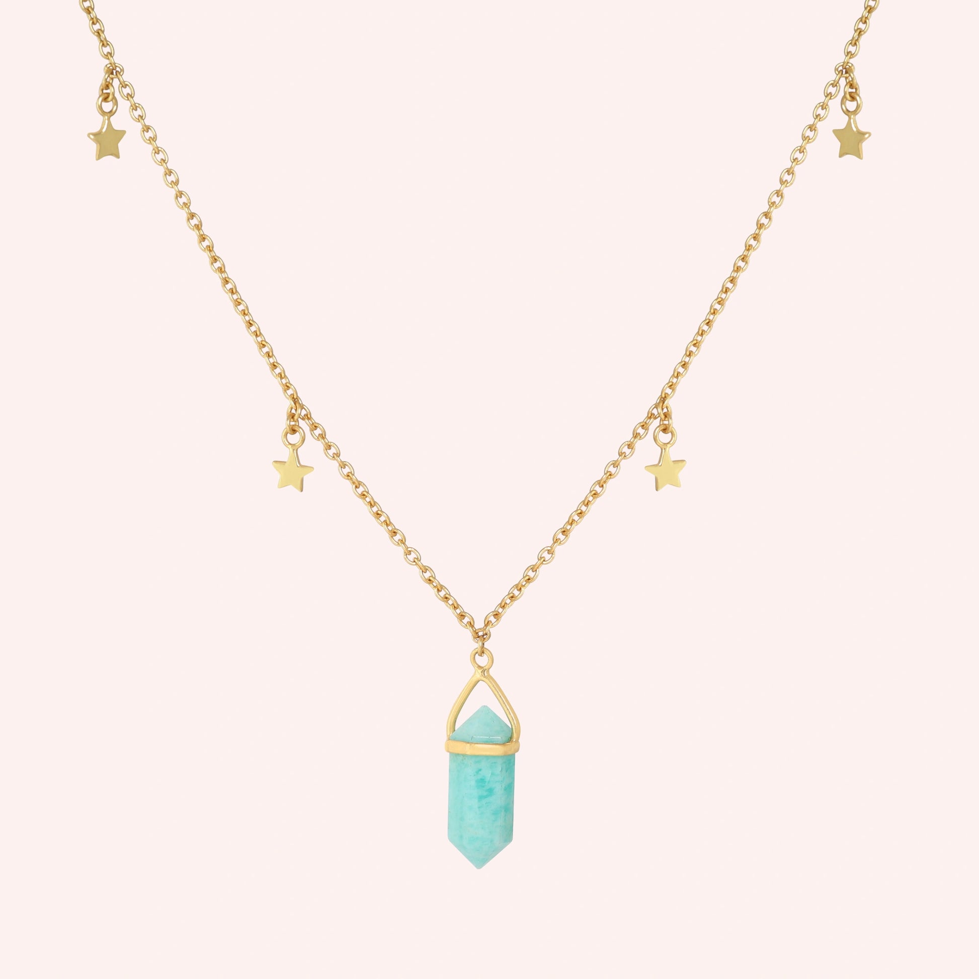 Charm_necklace_in_front_angled_view_with_gold_plated_silver_chain_star_charms_and_amazonite_stone_on_solid_pink_background