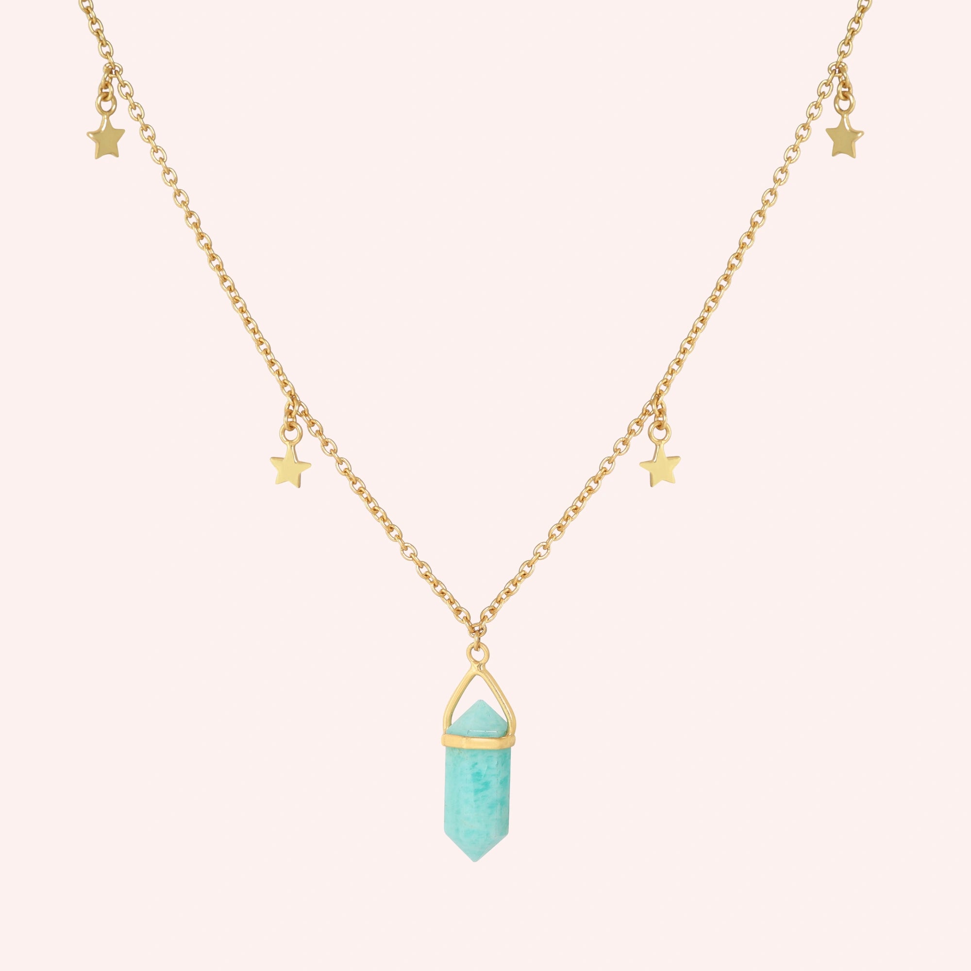 Charm_necklace_in_front_angled_view_with_gold_plated_silver_chain_star_charms_and_amazonite_stone_on_solid_pink_background