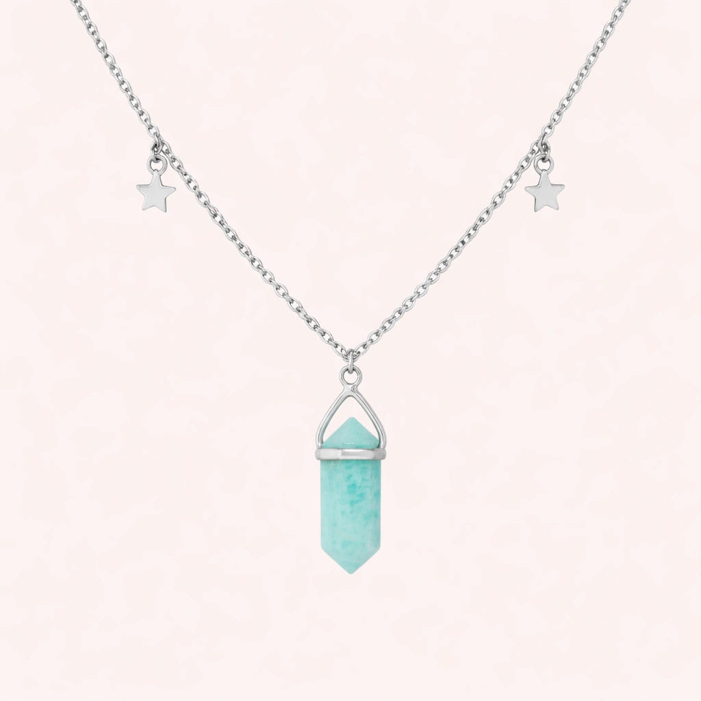 Charm_necklace_in_front_angled_view_with_sterling_silver_chain_star_charms_and_amazonite_stone_on_soft_fabric_background