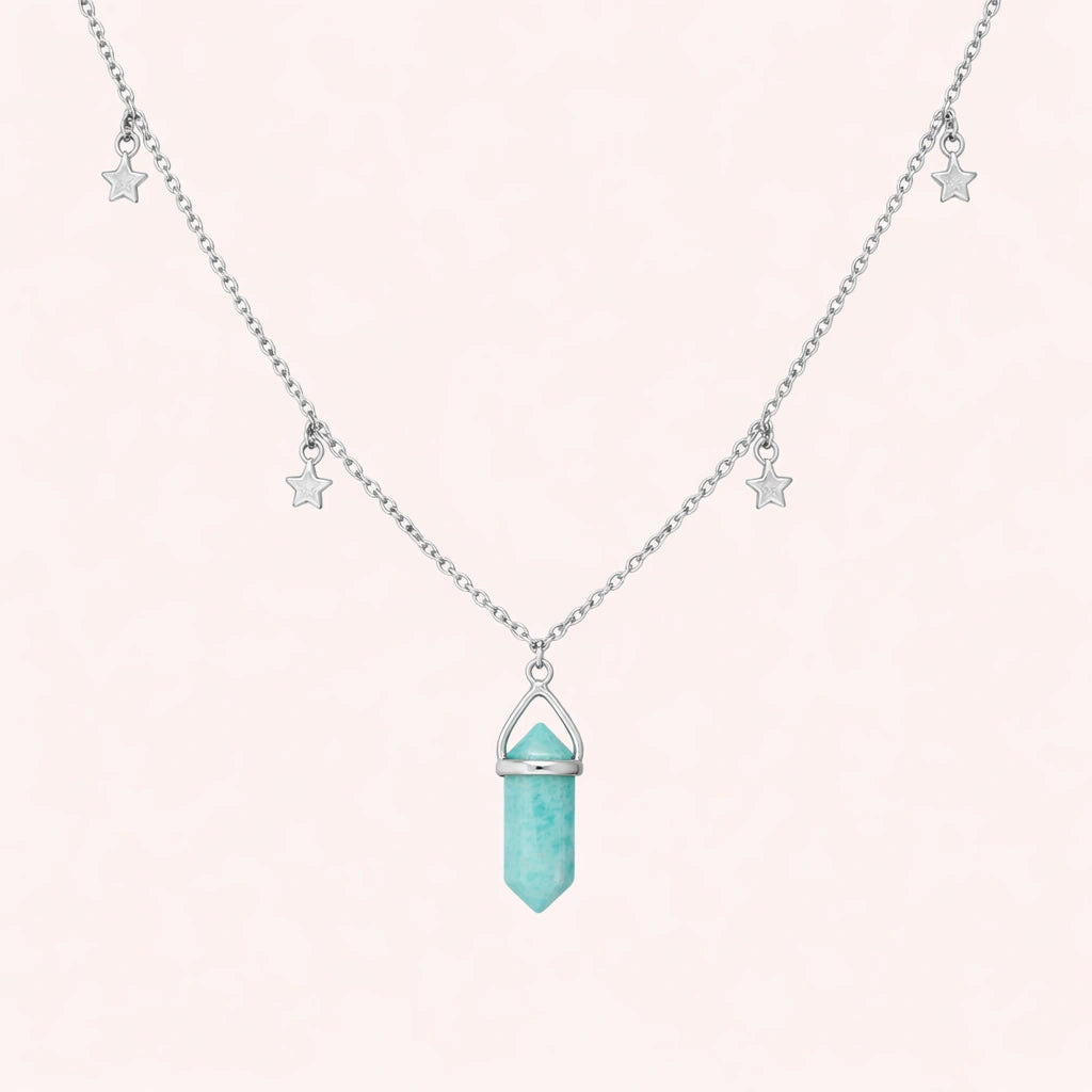 Charm_necklace_in_front_angled_view_with_sterling_silver_chain_star_charms_and_amazonite_stone_on_solid_pink_background