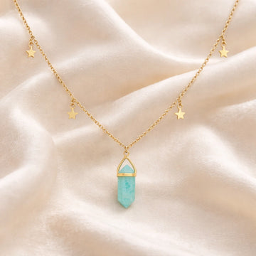 Charm_necklace_in_front_angled_view_with_gold_plated_silver_chain_star_charms_and_amazonite_stone_on_soft_fabric_background