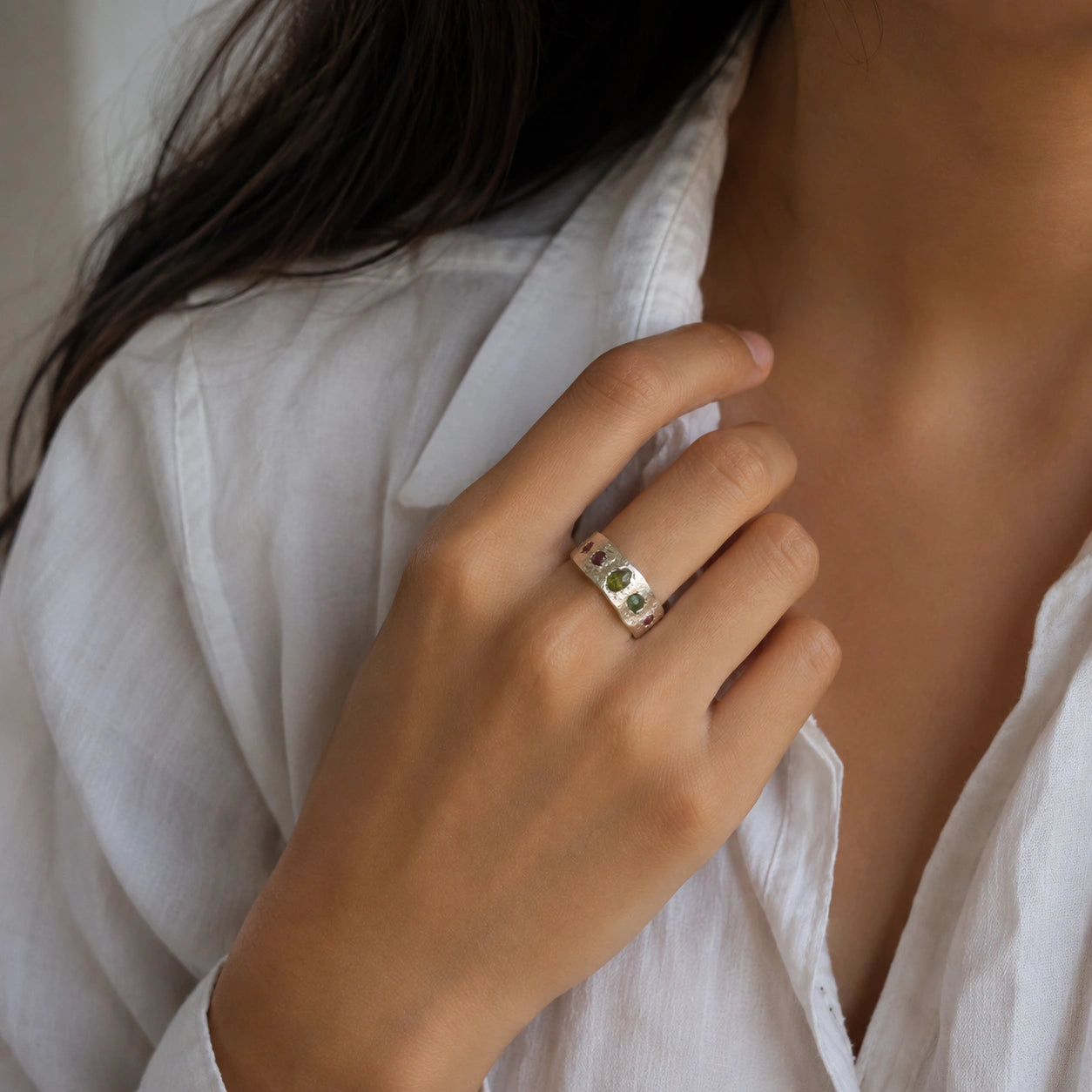 Chunky_ring_in_sterling_silver_with_pink_tourmaline_peridot_and_blue_topaz_stones_worn_by_a_model