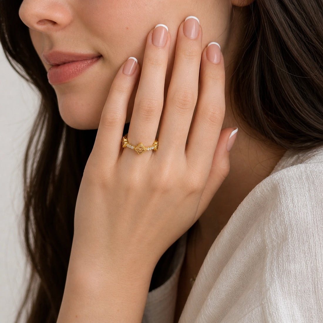 Citrine_ring_gold_plated_silver_floral_band_with_citrine_and_white_topaz_in_front_angle_view_on_soft_fabric_background