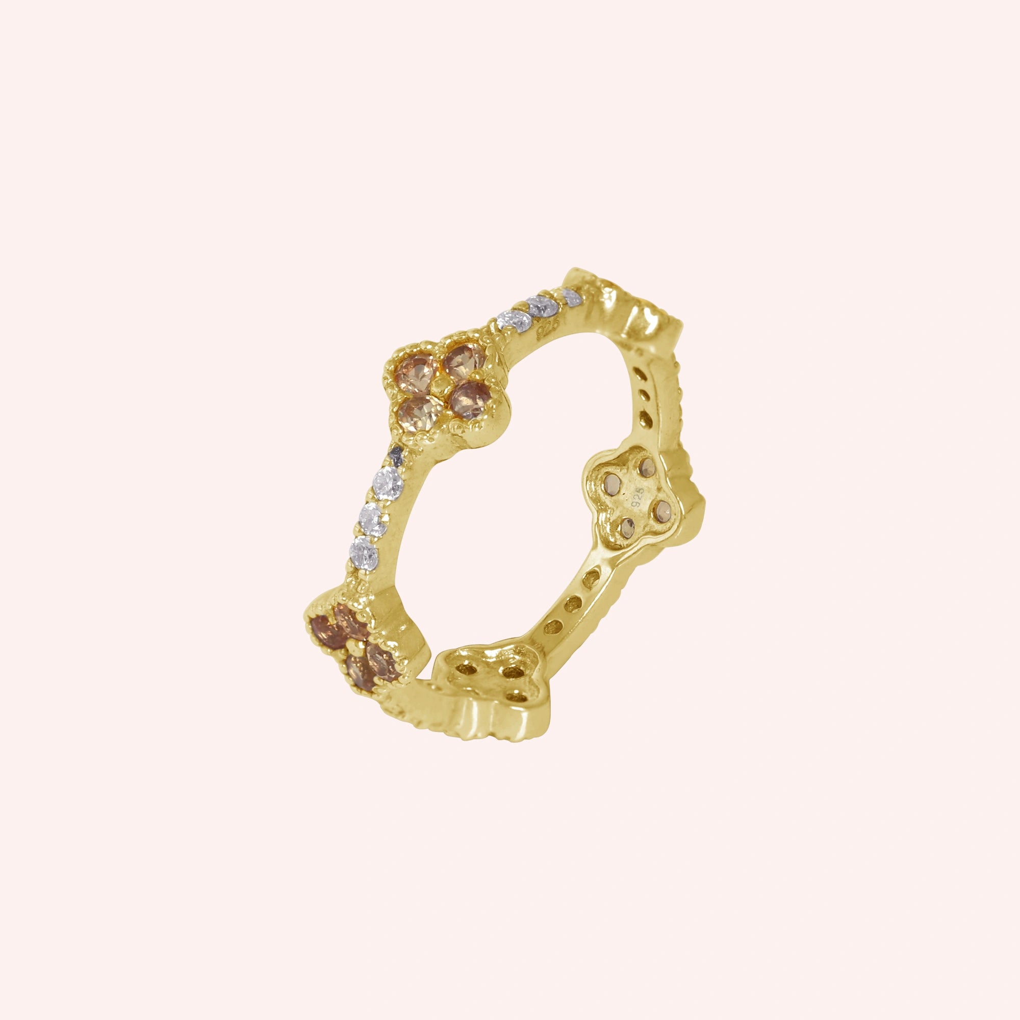 Citrine_ring_gold_plated_silver_floral_band_with_citrine_and_white_topaz_in_slightly_tilted_on_solid_pink_background