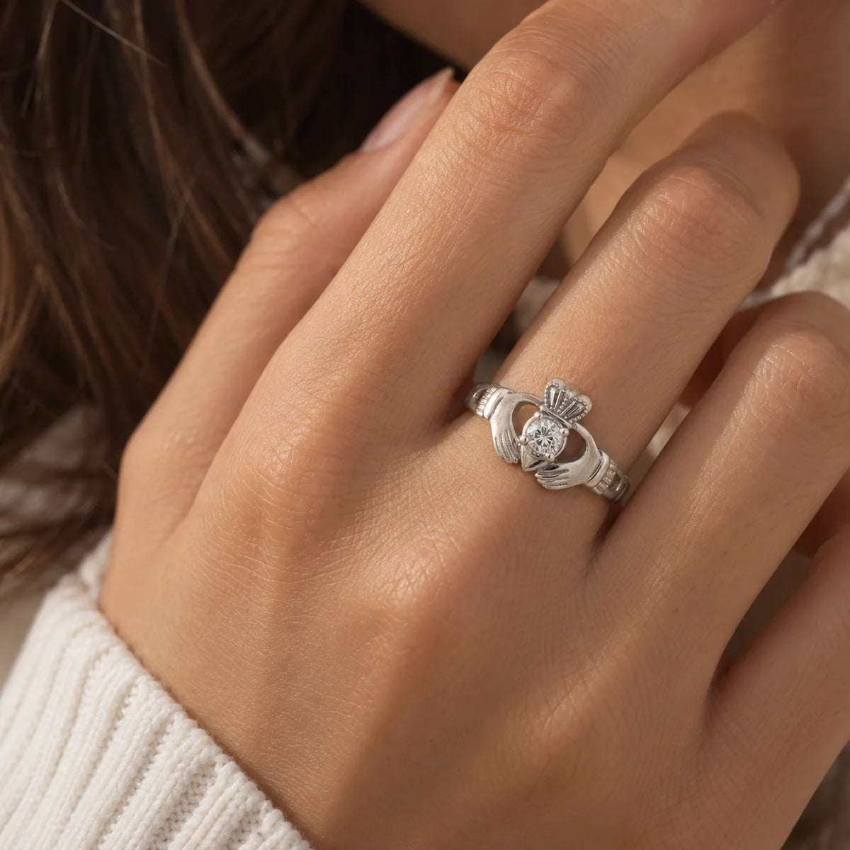 Claddagh_ring_in_sterling_silver_with_a_round_lab_grown_diamond_stone_worn_by_a_model