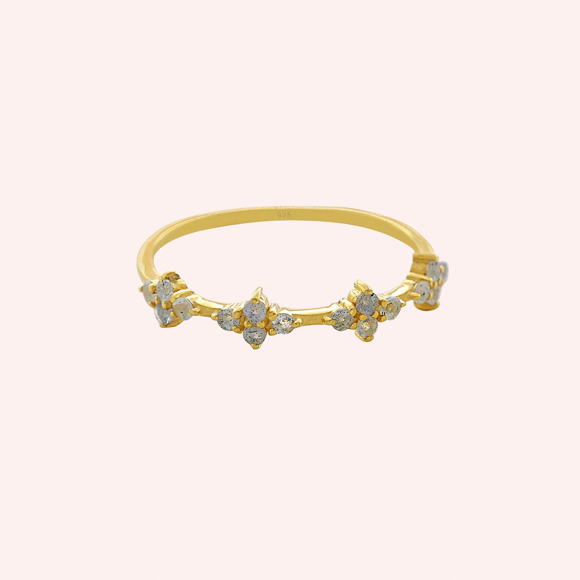 Cluster_ring_gold_plated_silver_band_with_small_clusters_and_labradorite_stones_at_front_angle_on_solid_pink_background