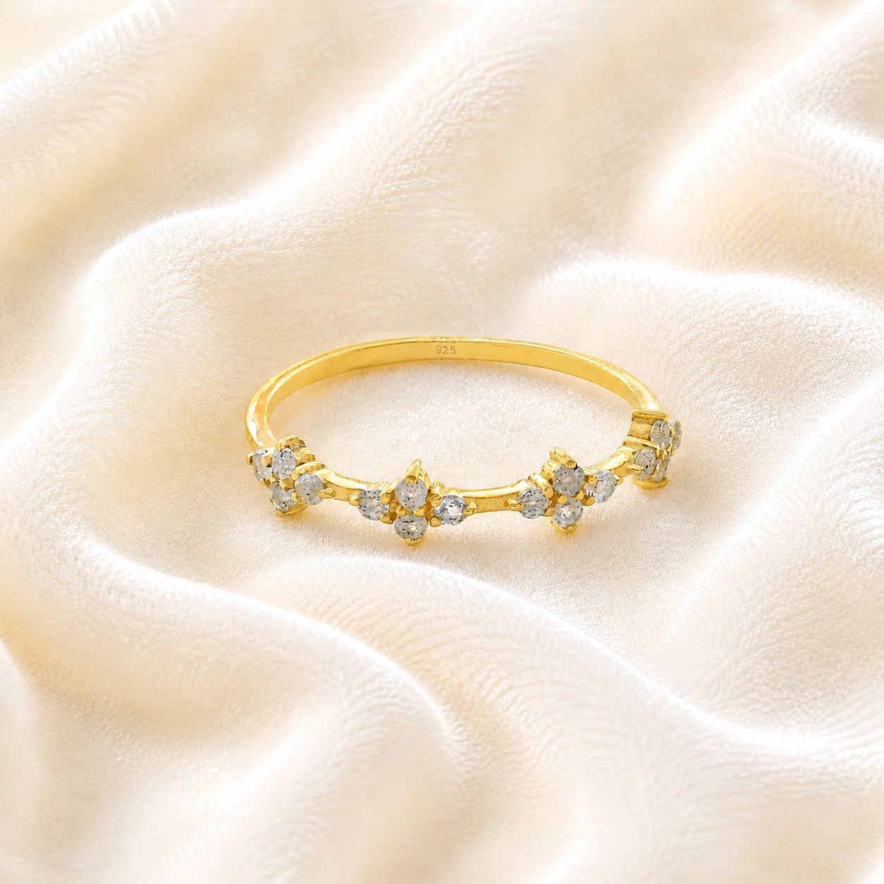 Cluster_ring_gold_plated_silver_band_with_small_clusters_and_labradorite_stones_at_front_angle_on_soft_fabric_background