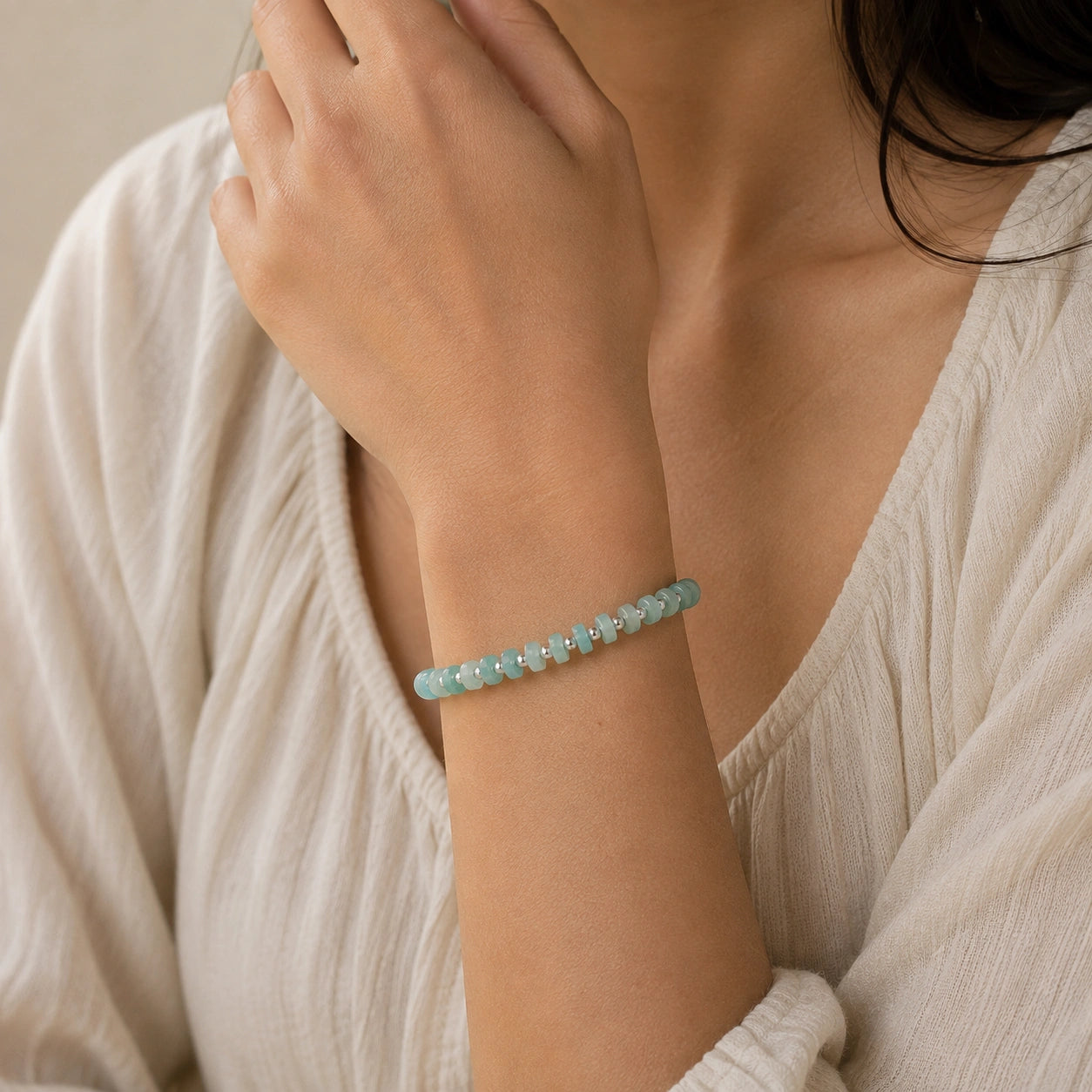 Crystal_bead_bracelet_with_amazonite_stones_and_sterling_silver_beads_worn_by_a_model