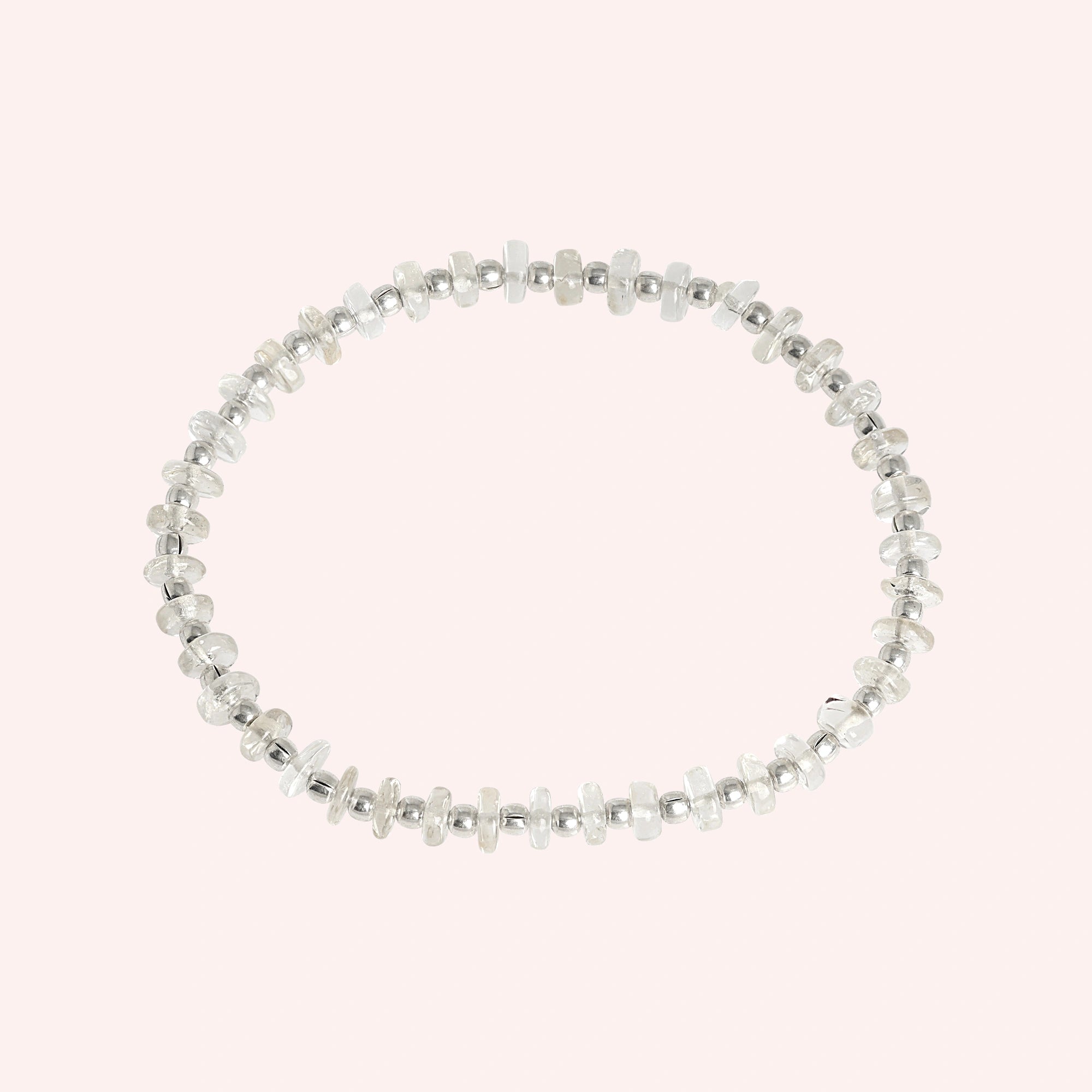 Crystal_bracelet_with_crystal_and_sterling_silver_beads_at_front_angle_view_on_solid_pink_background