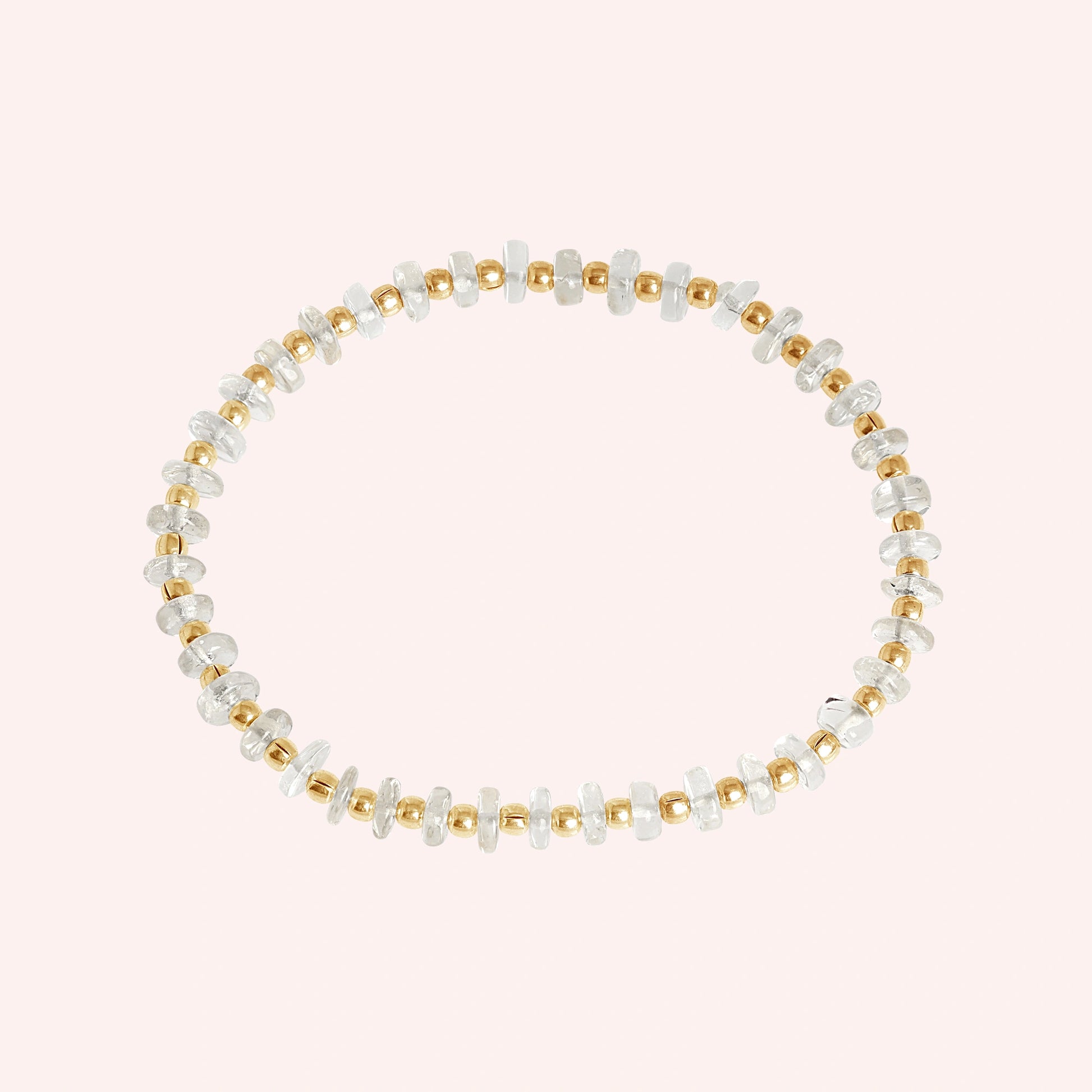 Crystal_bracelet_with_crystal_and_gold_plated_silver_beads_at_front_angle_view_on_solid_pink_background