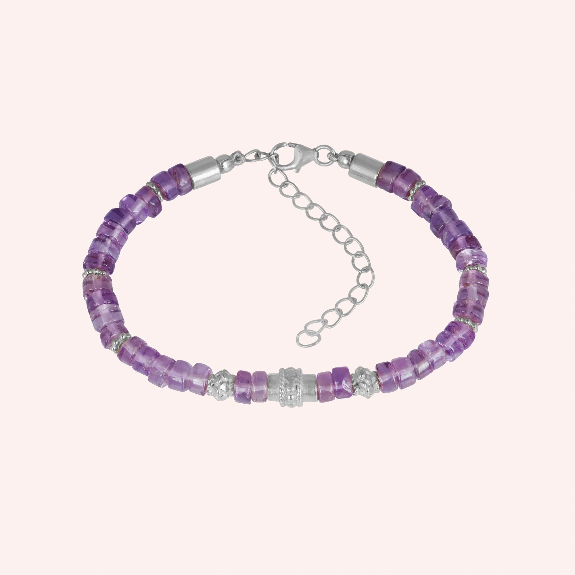 top_angle_crystal_bracelet_with_faceted_purple_stones_and_silver_spacers_amethyst_bracelet_on_soft_cream_background