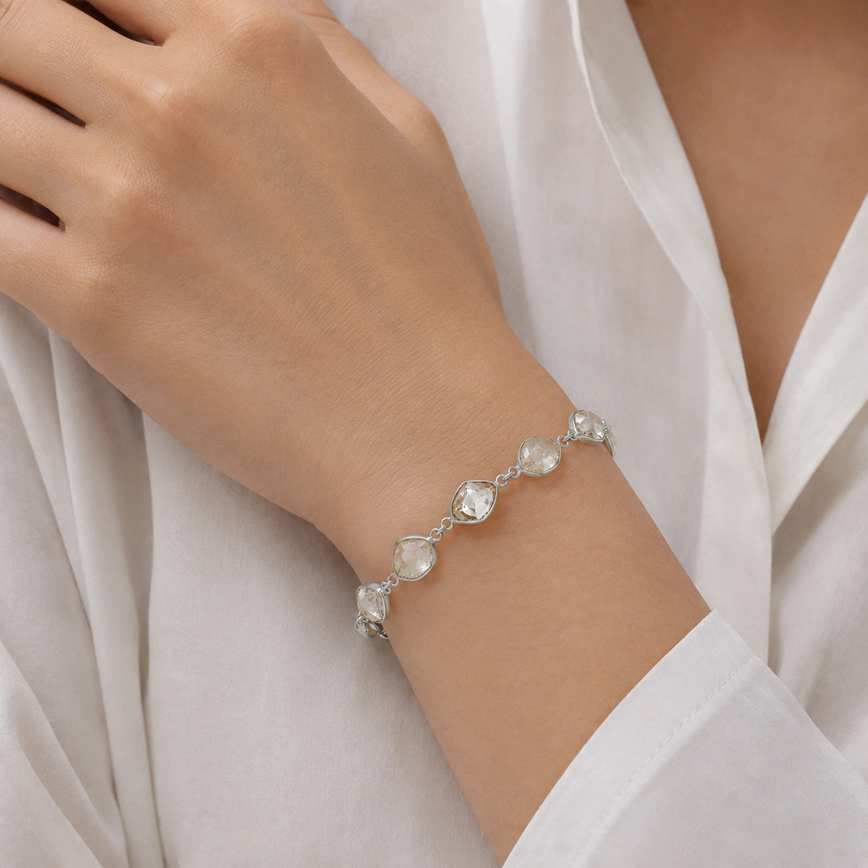 Crystal_bracelet_in_sterling_silver_with_raw_herkimer_stones_worn_by_a_model