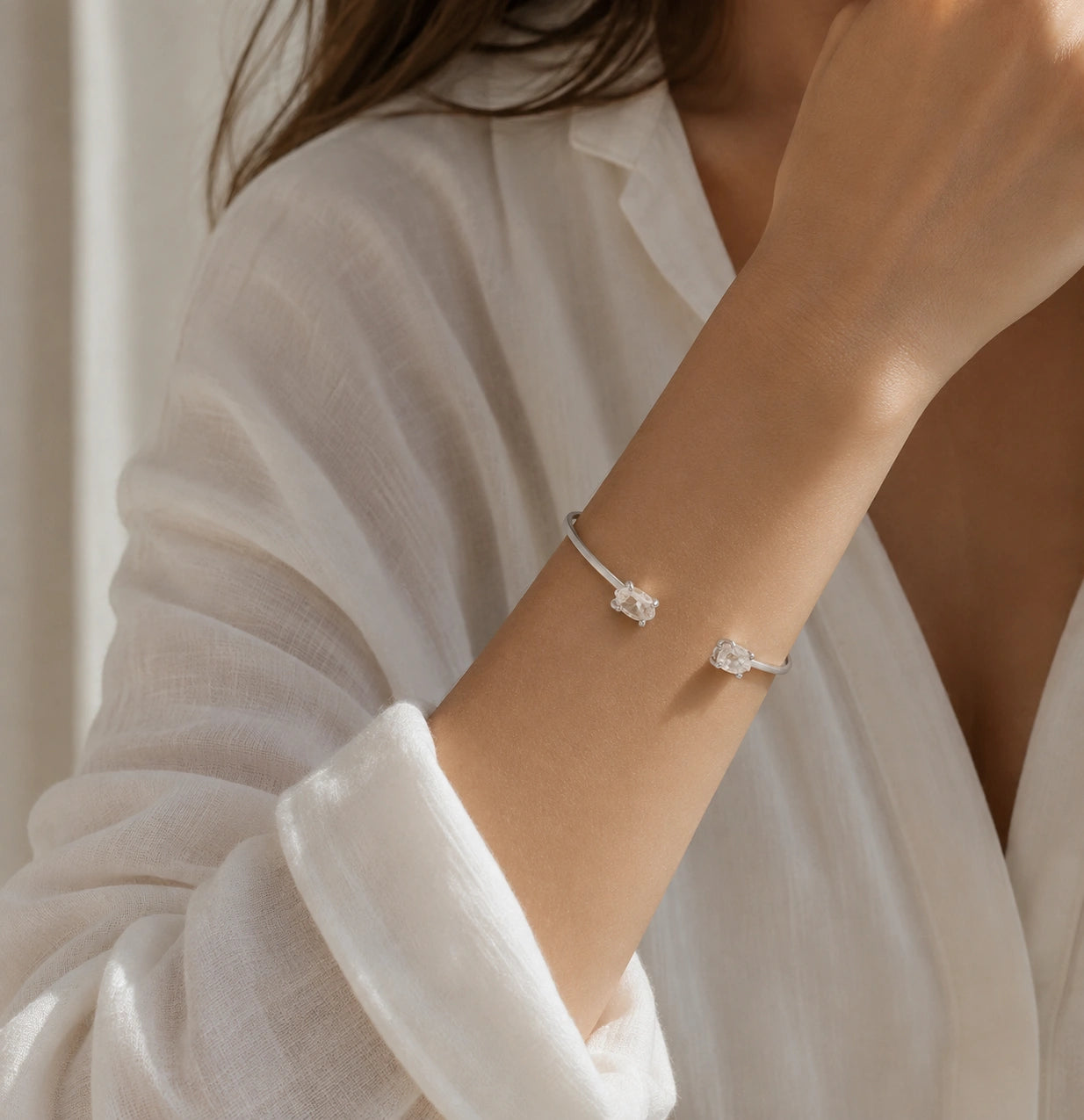 Crystal_bracelet_in_sterling_silver_with_two_raw_herkimer_stones_worn_by_a_model