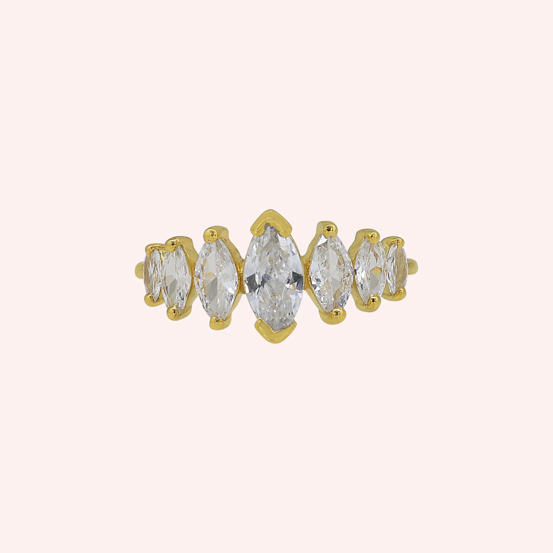 Designer_ring_in_gold_plated_silver_with_marquise_cut_CZ_stones_at_side_angle_view_on_soft_fabric_background