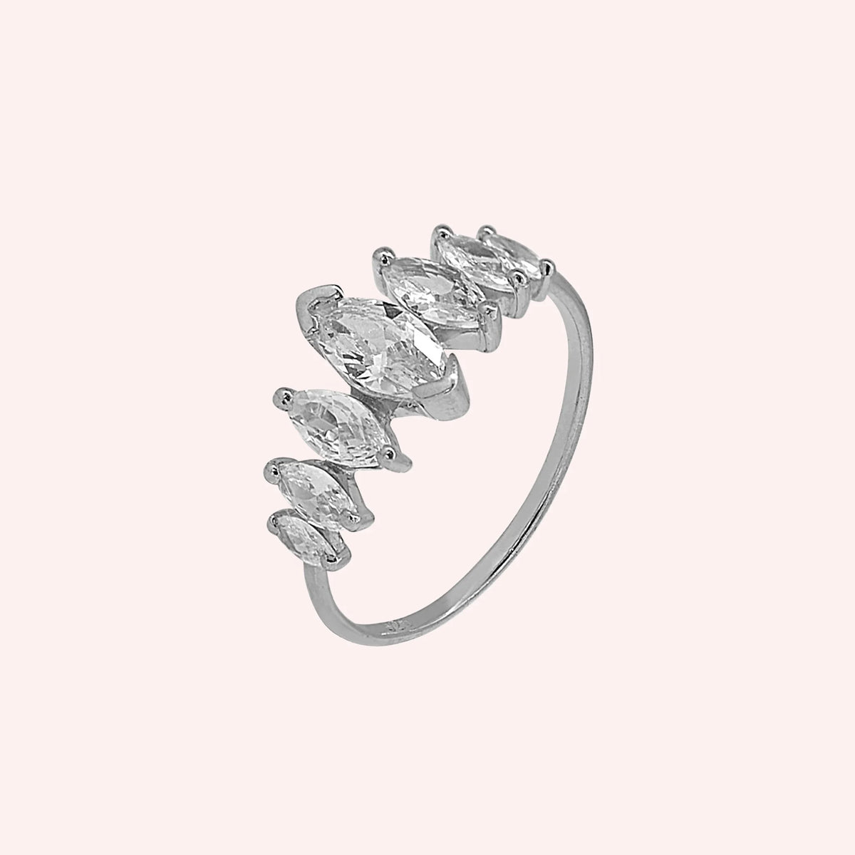 Designer_ring_in_sterling_silver_with_marquise_cut_CZ_stones_at_side_angle_view_on_solid_pink_background