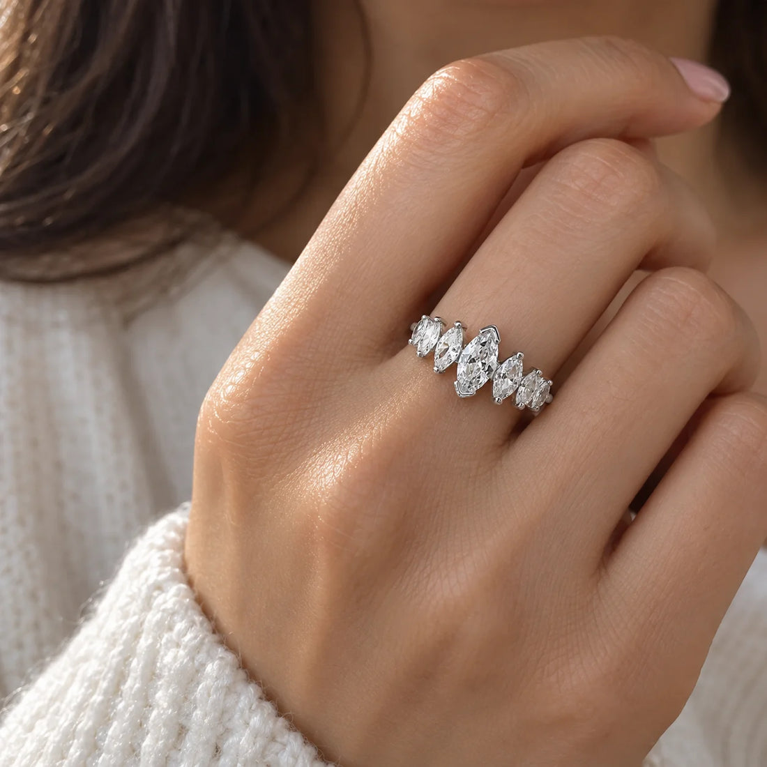 Designer_ring_in_gold_plated_silver_with_marquise_cut_lab_grown_diamonds_at_front_angle_view_on_soft_fabric_background