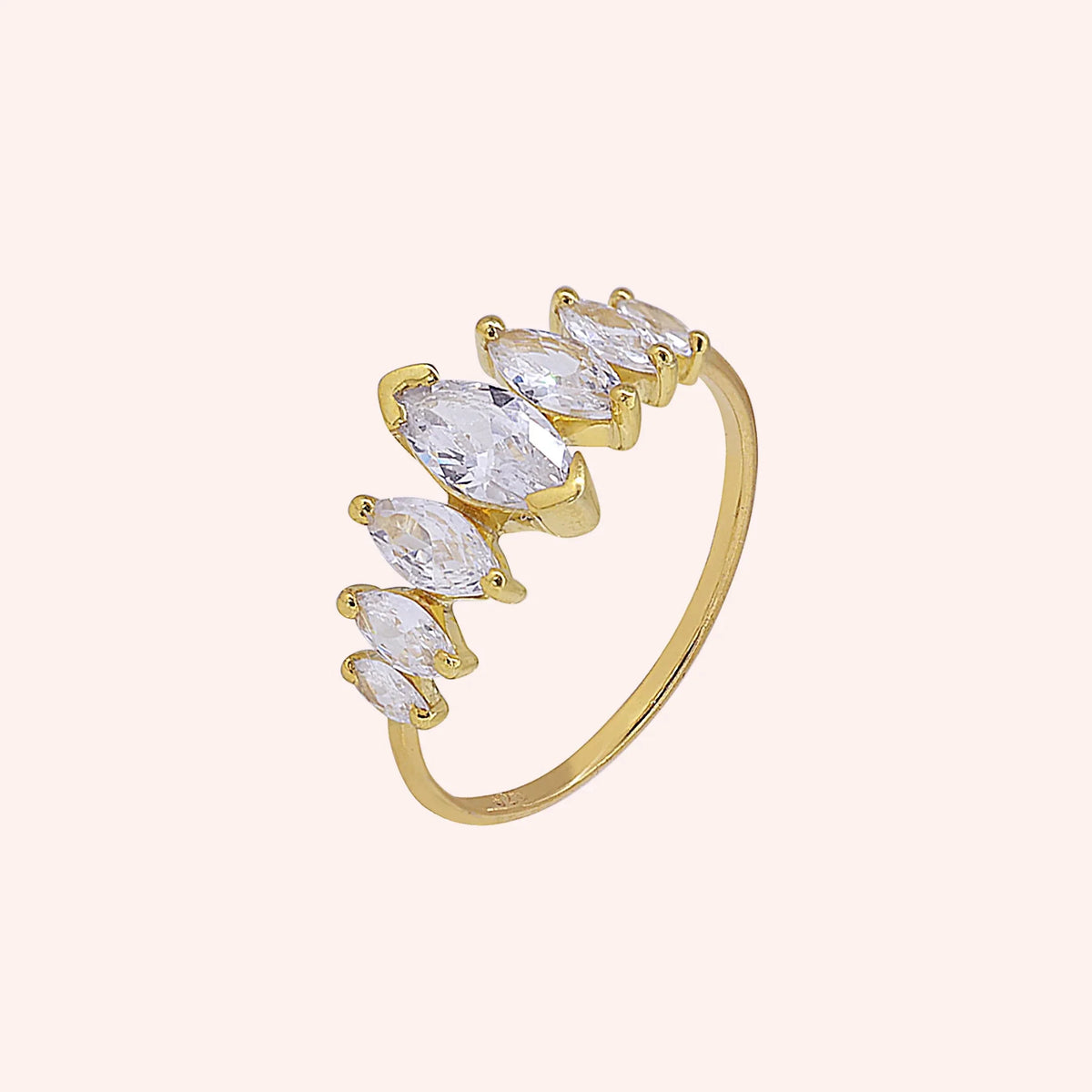 Designer_ring_in_gold_plated_silver_with_marquise_cut_lab_grown_diamonds_at_side_angle_view_on_solid_pink_background