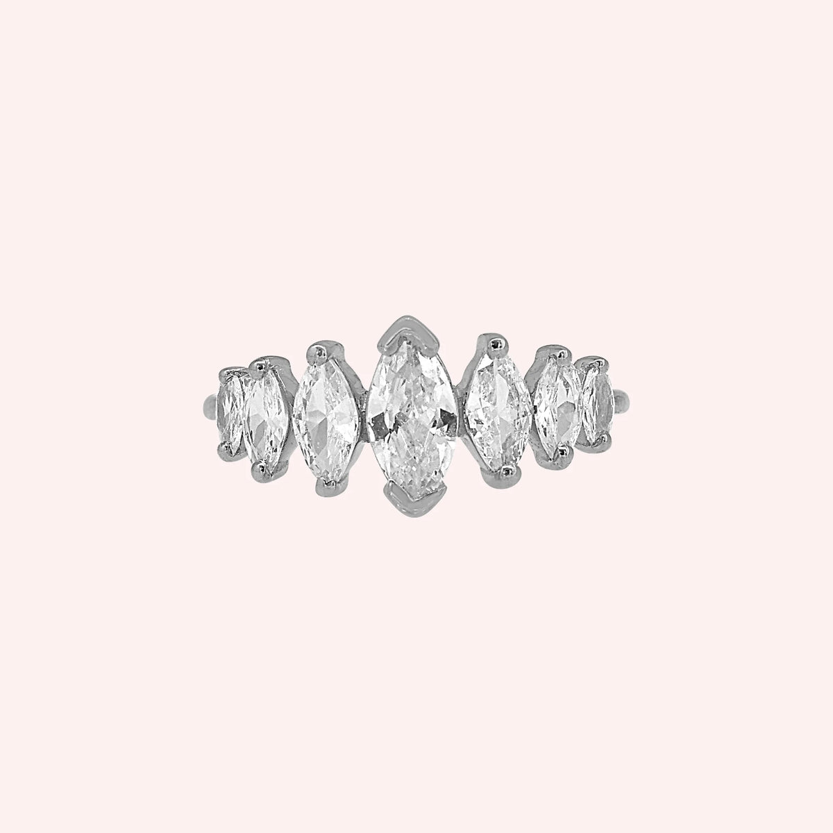 Designer_ring_in_sterling_silver_with_marquise_cut_lab_grown_diamonds_at_front_angle_view_on_solid_pink_background