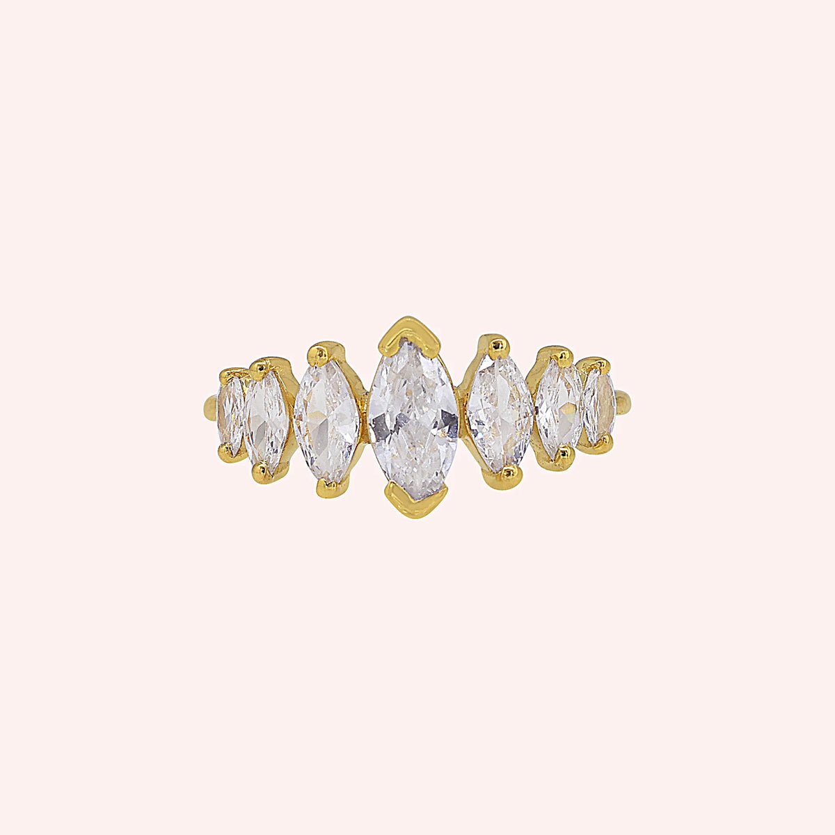 Designer_ring_in_gold_plated_silver_with_marquise_cut_lab_grown_diamonds_at_front_angle_view_on_solid_pink_background