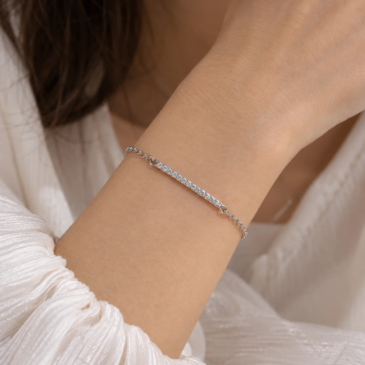 Diamond_bracelet_in_sterling_silver_with_a_bar_design_worn_by_a_model
