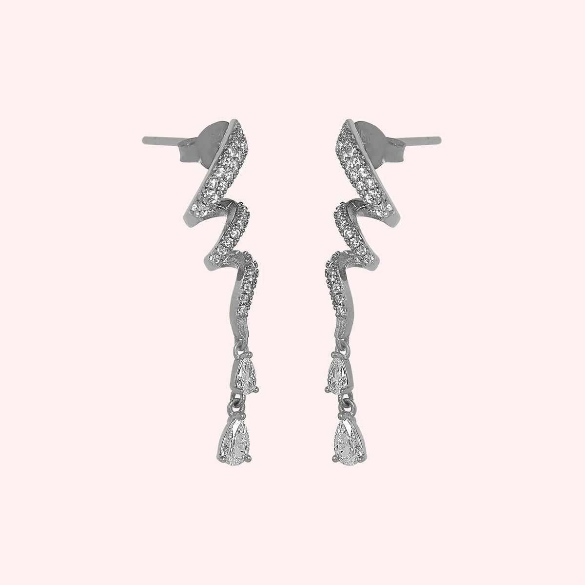 Diamond_drop_earrings_in_sterling_silver_with_twisted_design_lab_grown_diamonds_at_side_angle_view_on_solid_pink_background