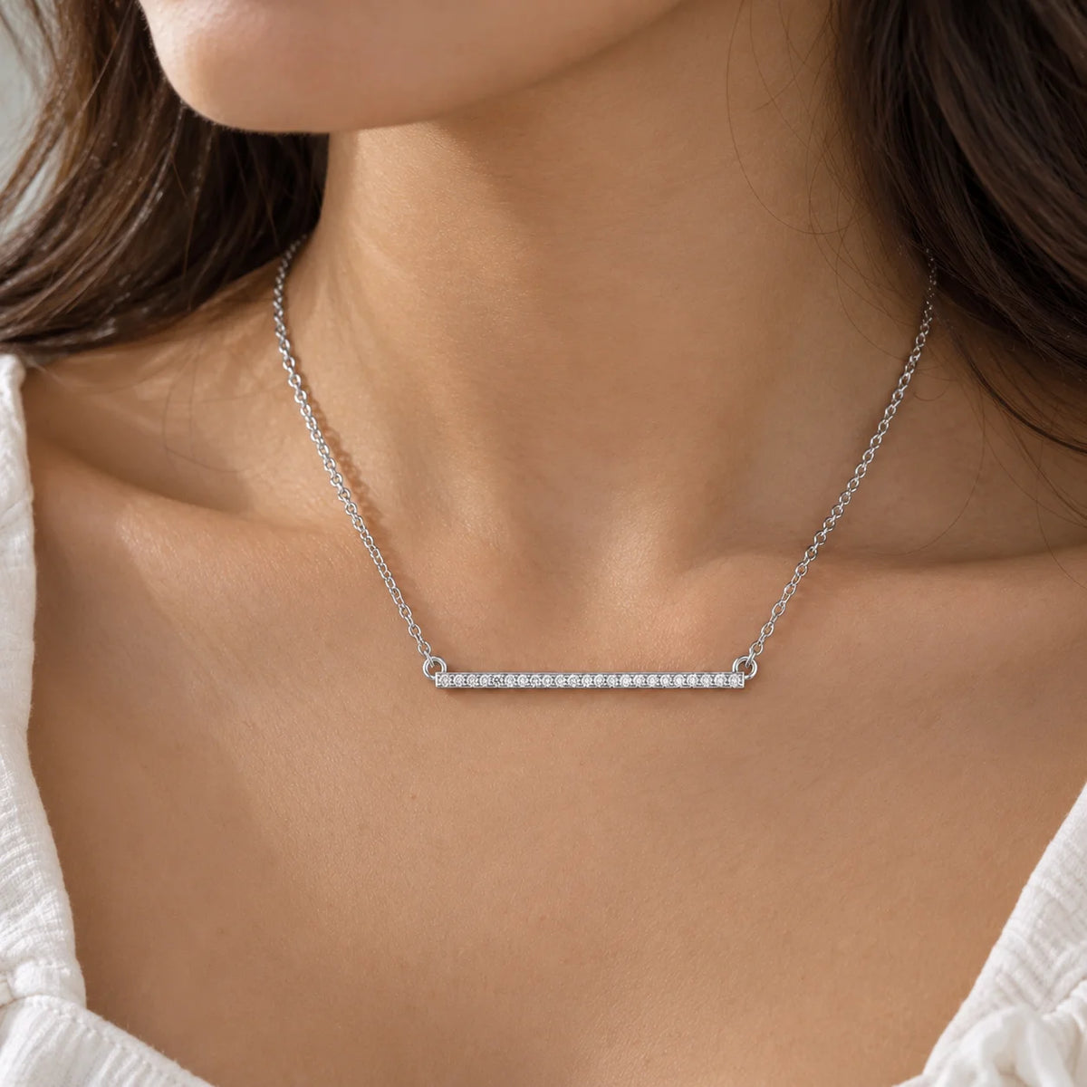 Diamond_necklace_in_sterling_silver_in_a_bar_design_worn_by_a_model
