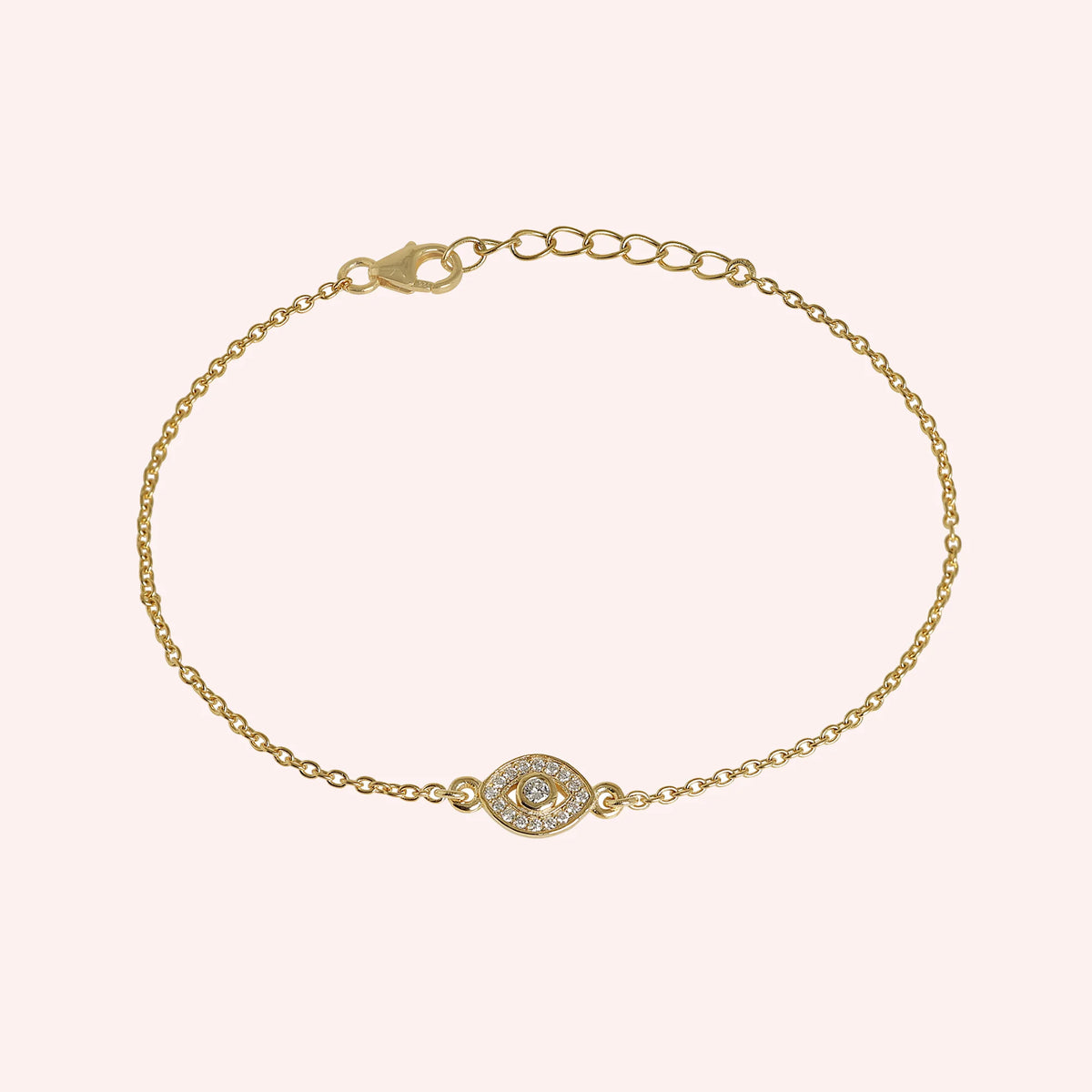 Evil_eye_bracelet_in_gold_plated_silver_with_lab_grown_diamonds_at_front_angle_view_on_solid_pink_background