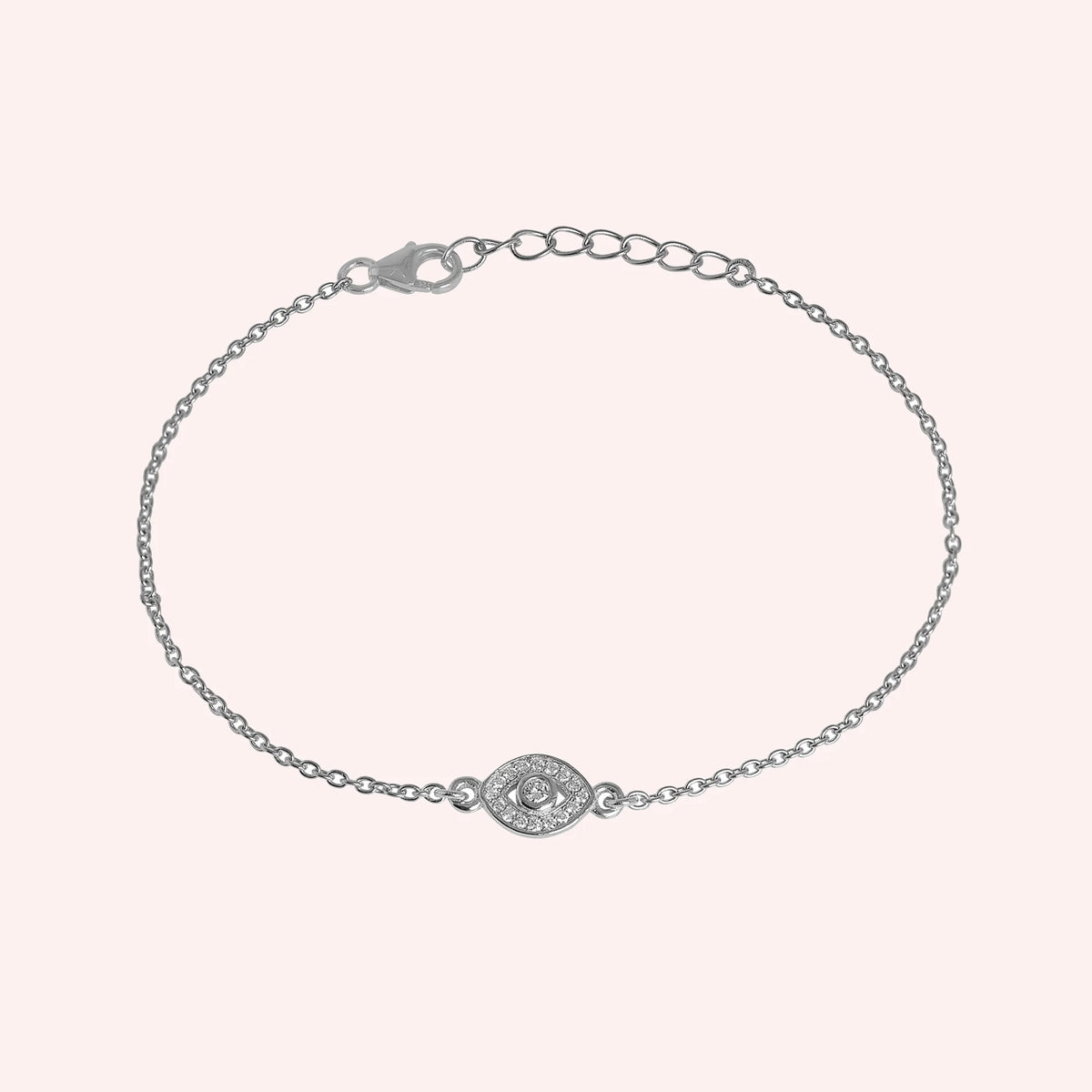 Evil_eye_bracelet_in_sterling_silver_with_lab_grown_diamonds_at_front_angle_view_on_solid_pink_background