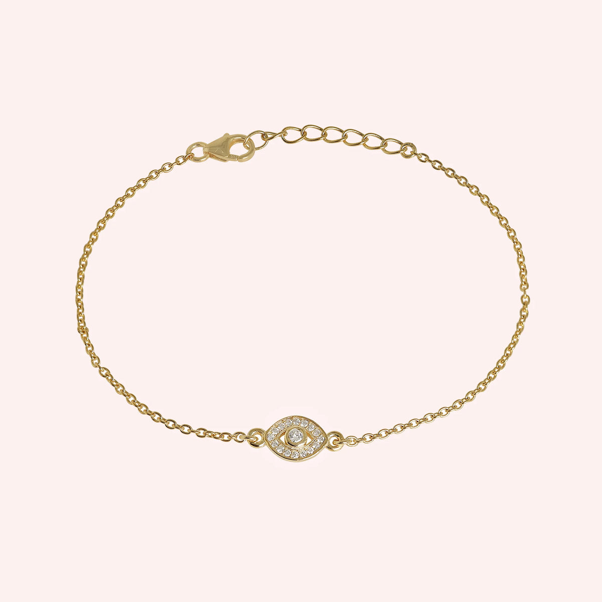 Evil_eye_bracelet_in_gold_plated_silver_with_CZ_stones_at_front_angle_view_on_solid_pink_background