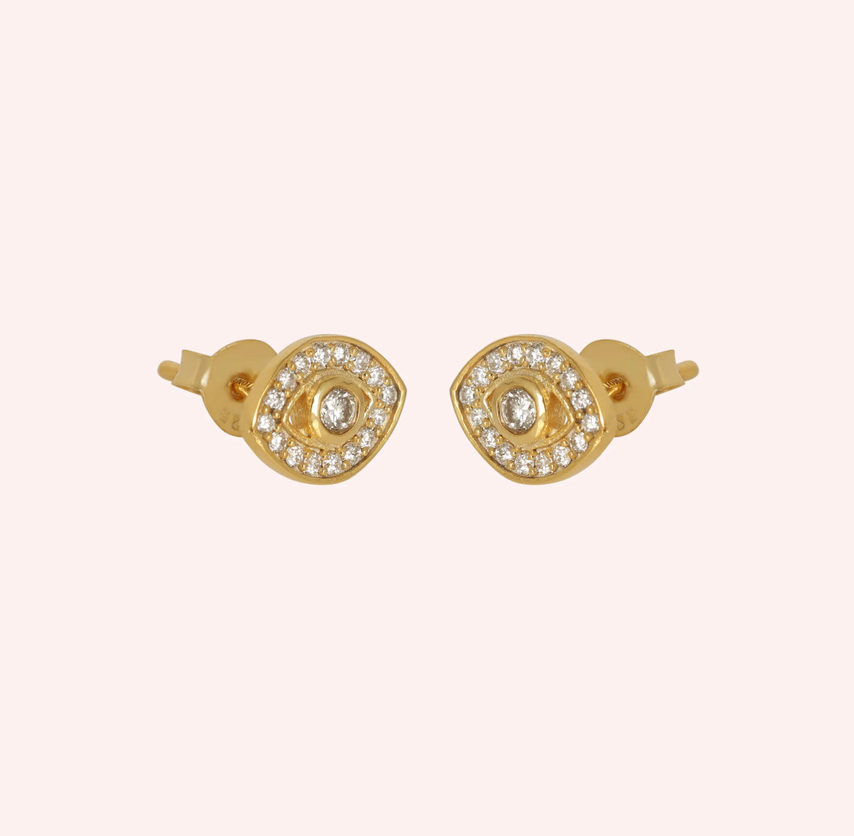 Evil_eye_earrings_in_gold_plated_silver_with_lab_grown_diamonds_at_slight_angle_view_on_solid_pink_background