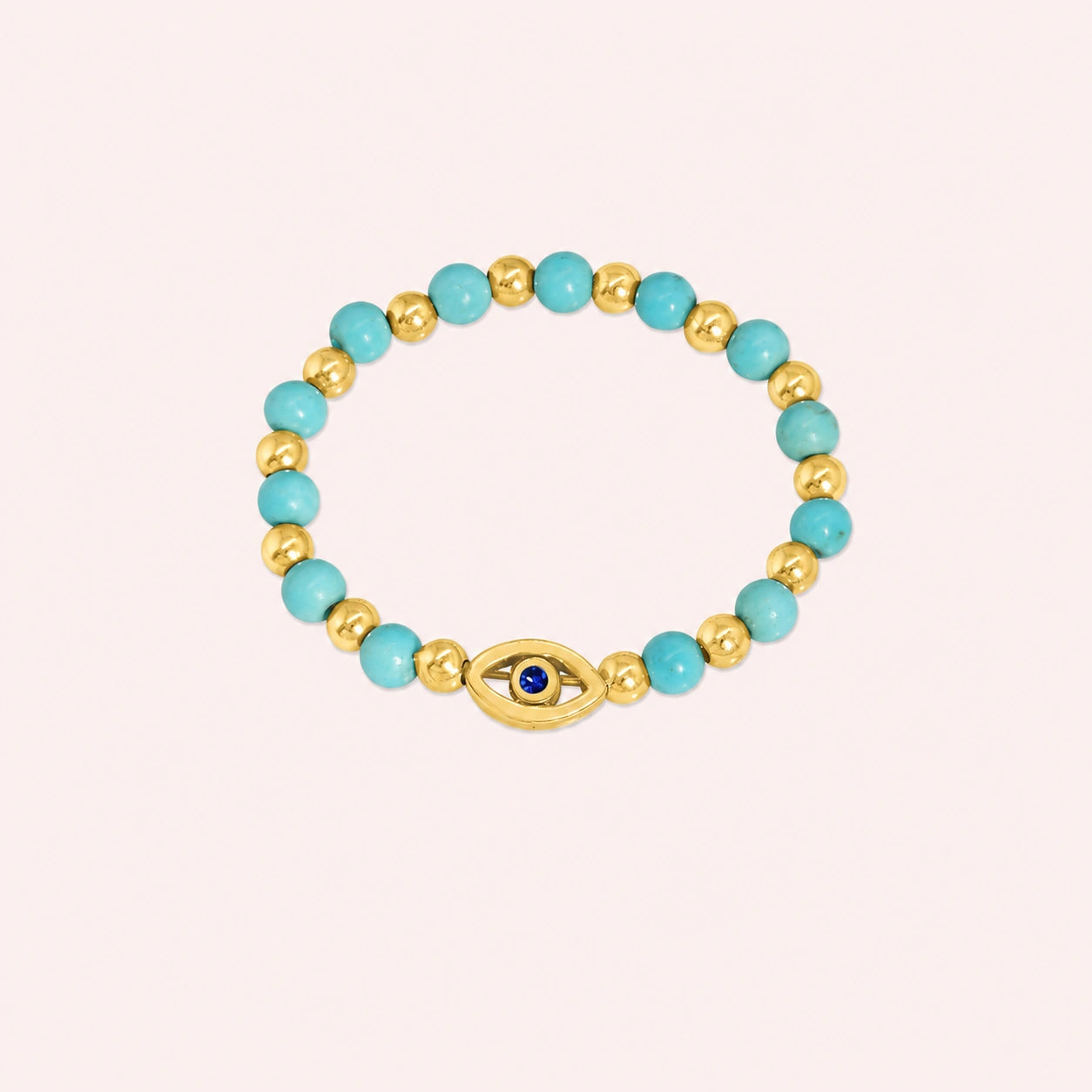 Evil_eye_ring_featuring_turquoise_and_gold_plated_silver_beads_with_blue_iolite_in_front_angle_on_solid_pink_background